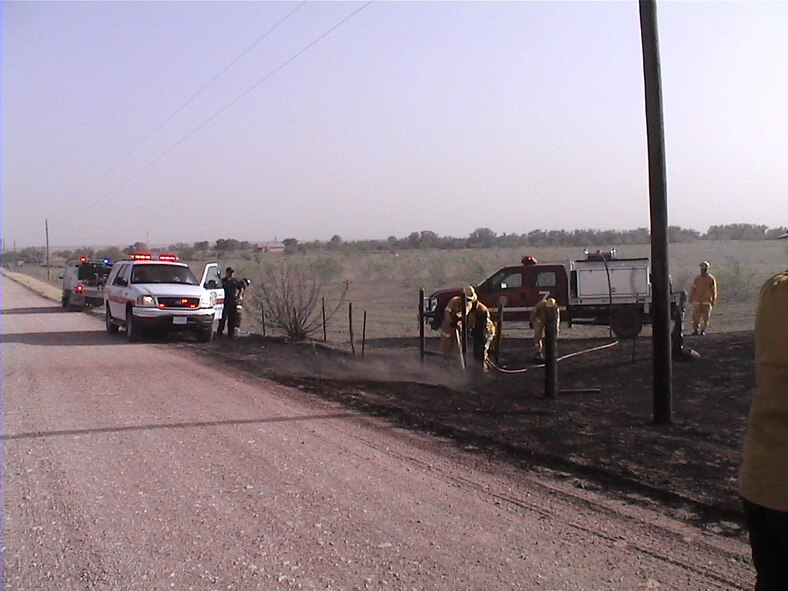 WEST TEXAS - Dyess fire crews responded to call for mutual aid in a near 18,000 acre wildland fire. Fourteen fire fighters helped protect structures in the southeast section of the fire and prevented four from being destroyed. (U.S. Air Force photo)                    