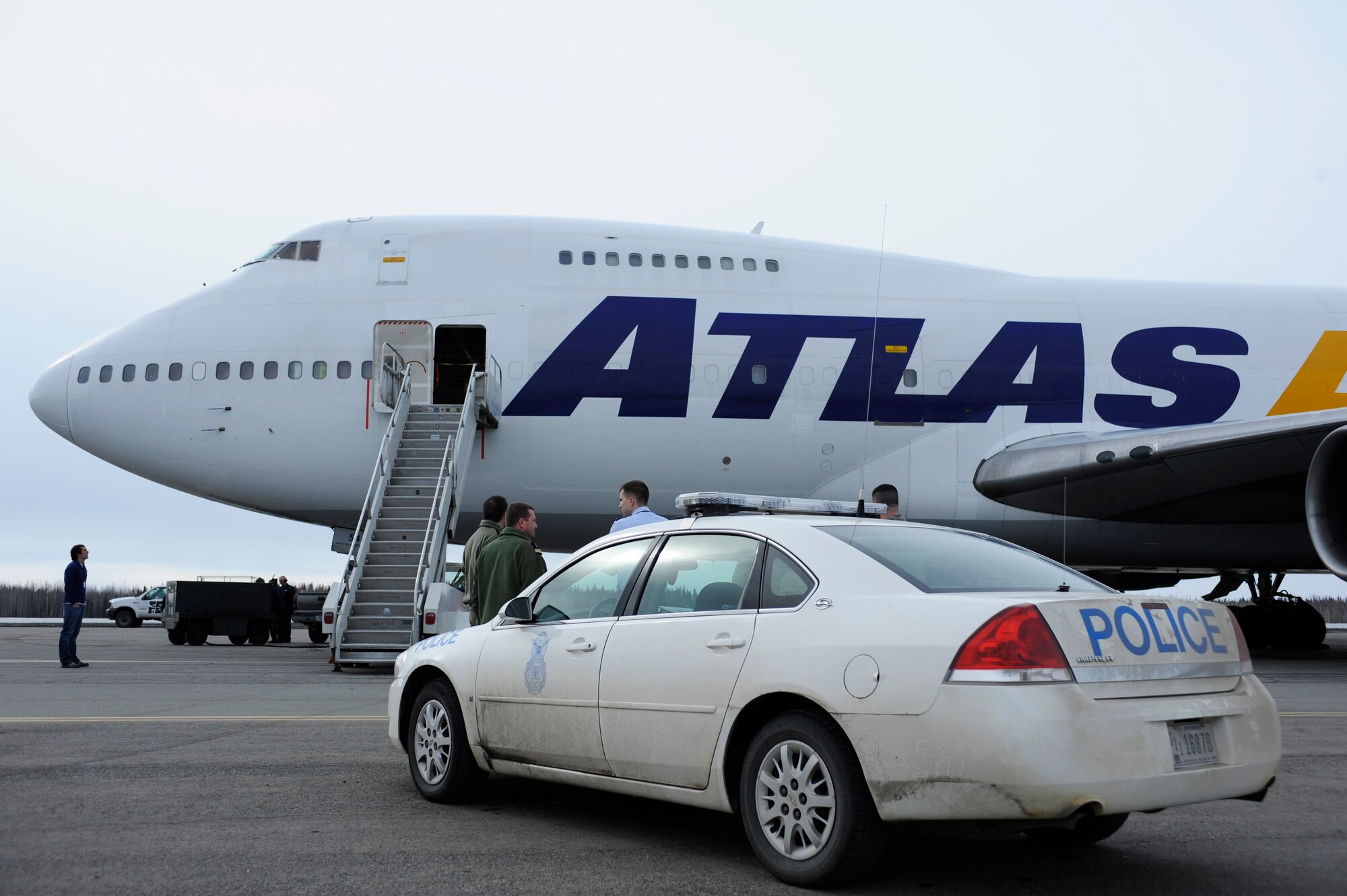 A Boeing 747 carrying French Air Force cargo sits on the tarmac while Staff Sgt. Douglas Weber and Senior Airman Adam Klockziem perform a U.S. customs inspection, April 13, 2009, Eielson Air Force Base Alaska. The French Arm?e de l'Air will be participating in the upcoming RED FLAG-Alaska 09-2. Both Airmen are assigned to the 354th Security Forces Squadron.  (U.S. Air Force photo/Senior Airman Jonathan Snyder)