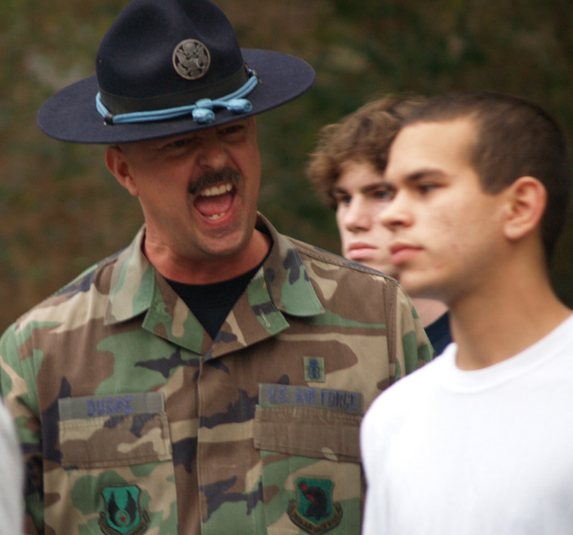 Senior Master Sgt. Grant Dugre barks commands at a recruit recently as part of a Basic Military Training orientation for members of the 331st Recruiting Squadron delayed entry program. The orientation is intended to mentally prepare the young men and women for what they can expect upon arrival at Lackland Air Force Base for BMT. Sergeant Dugre is the 96th Security Forces Squadron first sergeant at Eglin AFB, Fla. (Photo courtesy Jeni Senter/Santa Rosa Press Gazette)