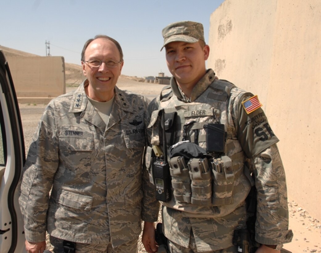 Staff Sergeant Charles Shipman, a Security Forces Airman with the 315th Airlift Wing, Charleston AFB, S.C., receives a coin from Air Force Reserve Command Commander Lt. Gen. Charles E. Stenner Jr., while deployed to Iraq, as a sign of his hard work and dedication to the joint CE/SFS Ballistic Tower project.  The Ballistic Tower project’s mission is to replace old dilapidated towers that offered little protection from enemy attacks.  