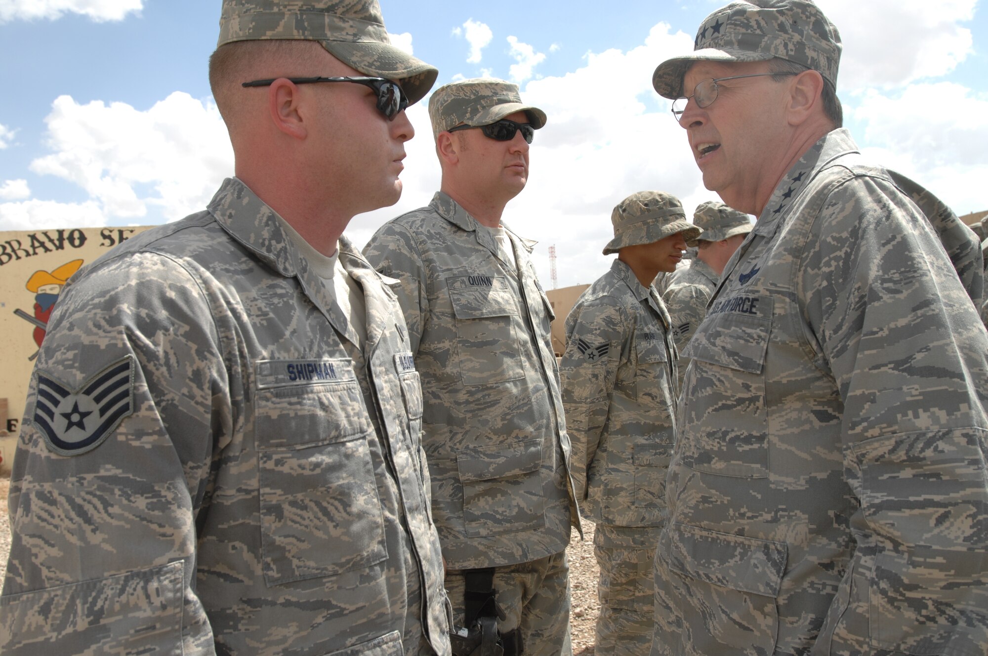 Staff Sergeant Charles Shipman, a Security Forces Airman with the 315th Airlift Wing, Charleston AFB, S.C., receives a coin from Air Force Reserve Command Commander Lt. Gen. Charles E. Stenner Jr., while deployed to Iraq, as a sign of his hard work and dedication to the joint CE/SFS Ballistic Tower project.  The Ballistic Tower project’s mission is to replace old dilapidated towers that offered little protection from enemy attacks.  