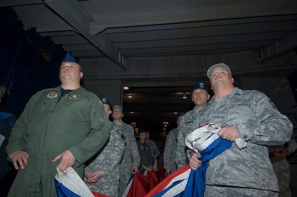 Minnesota National Guard Airmen and Soldiers wait in a tunnel of the Hubert H. Humphrey Metrodome with a giant American flag to used for the national anthem in the home opener for the Minnesota Twins on April 6, 2009. For Master Sgt. Rick Krivanek of the 109th Airlift Squadron (left), and Senior Master Sgt. Dan Flohr (right) of the 210th Engineering and Installation Squadron, it is thier 6th time on the field to participate in the honors. USAF Official Photo by Senior Master Sgt. Mark Moss