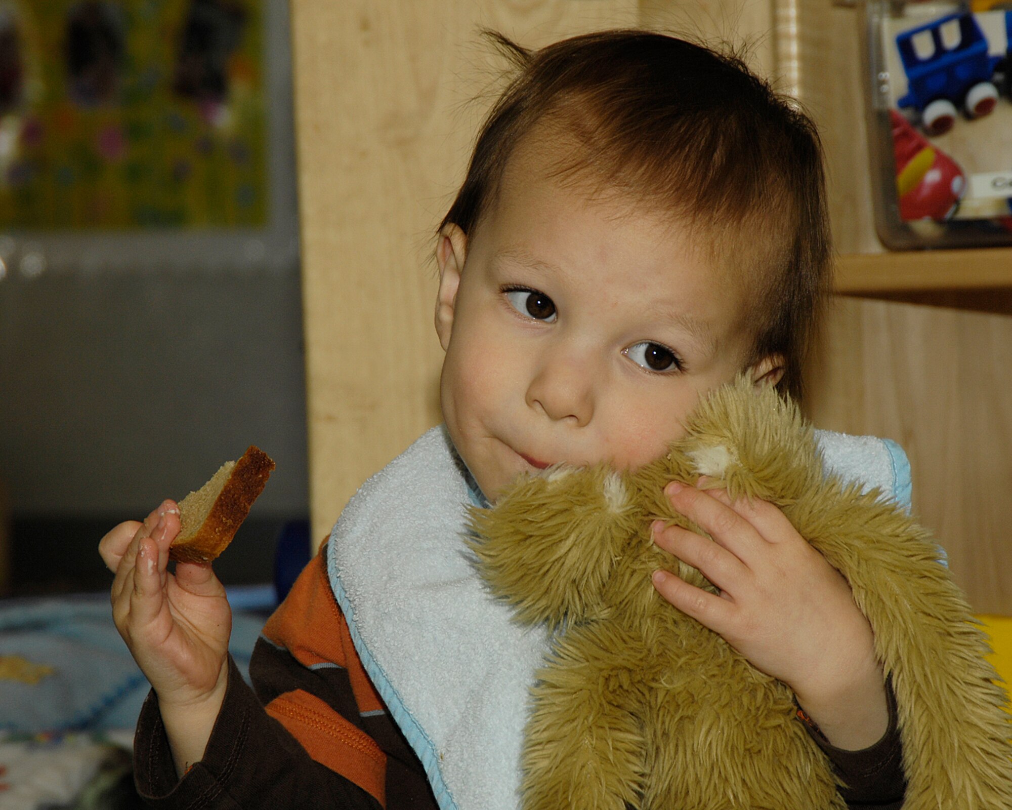 HANSCOM AIR FORCE BASE, Mass. - Kai Mackessy hugs his stuffed animal during the Teddy Bear picnic at the Hanscom Child Development Center on April 9. The CDC has activities taking place everyday throughout the month of April to celebrate Month of the Military Child. (U.S. Air Force photo by Linda LaBonte Britt)
