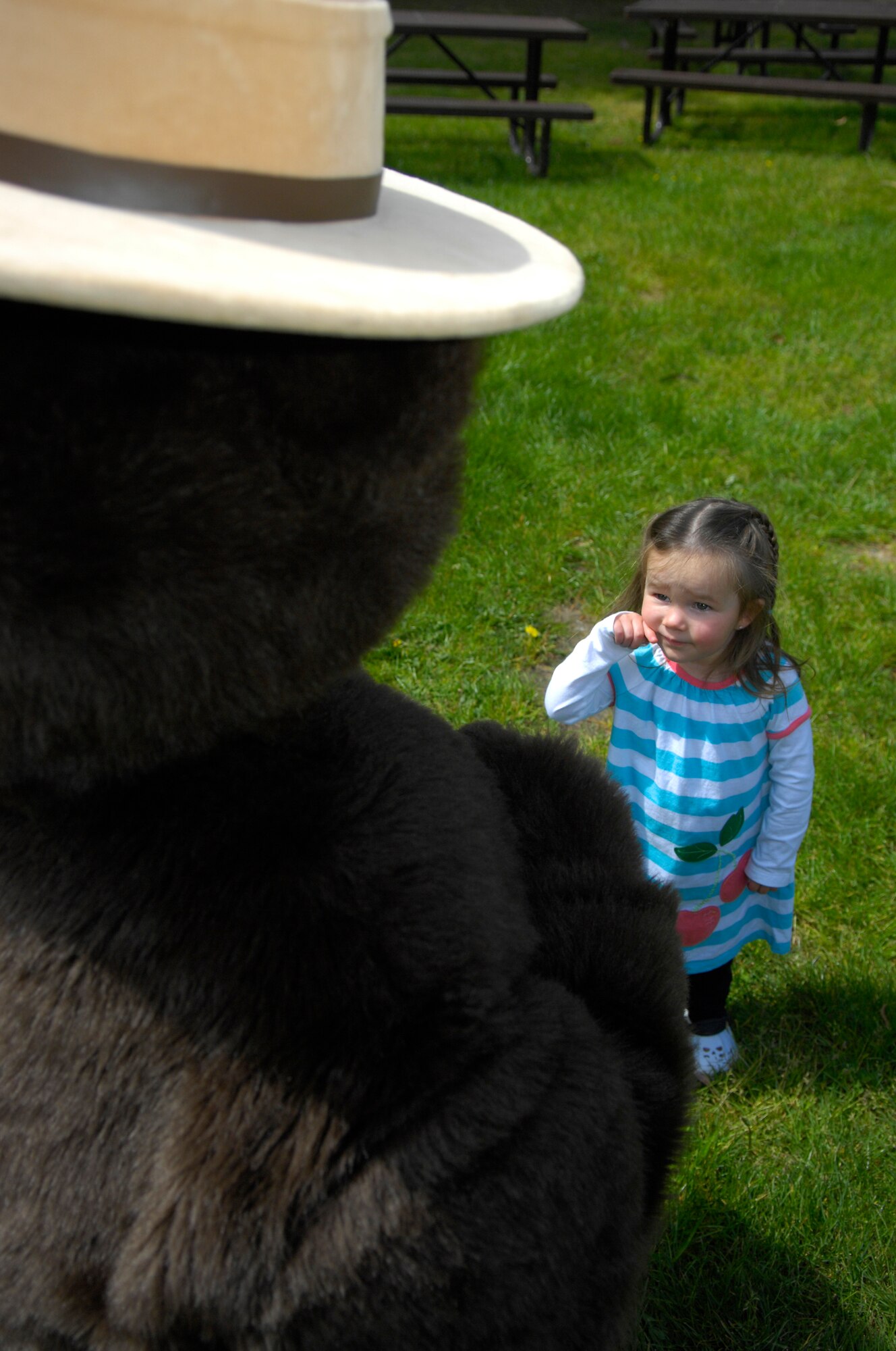 VANDENBERG AIR FORCE BASE, Calif. -- Kloe Hendricks learns a little about fire safety from Smokey the Bear during Fire Safety Day at Cocheo Park here April 10. The event, which was hosted by the 30th Civil Engineer Squadron's fire department, was held to teach children about the dangers of fire and how to react if around one. (U.S. Air Force photo/Airman 1st Class Andrew Lee) 
 
