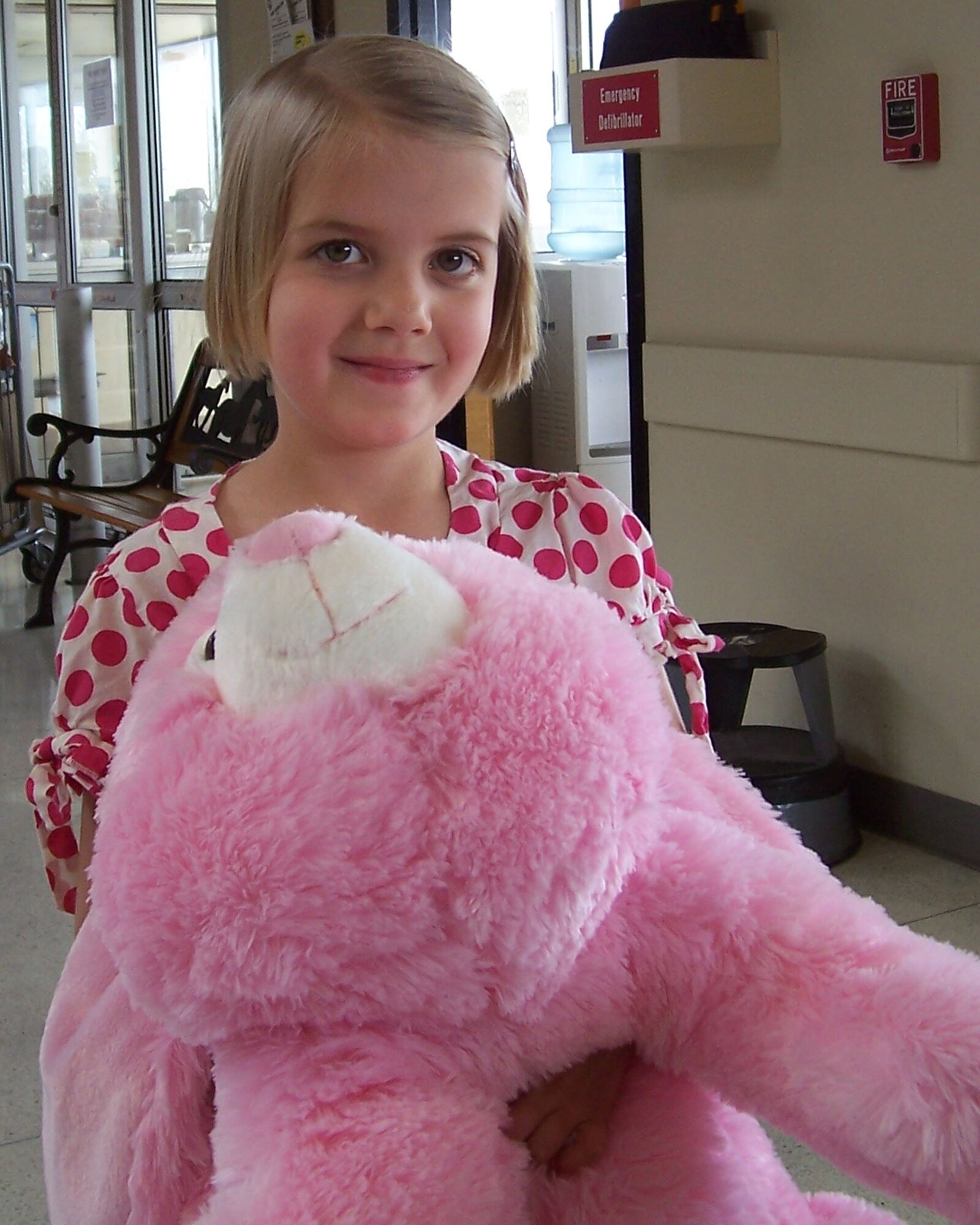 Charity Davis, 6, hugs her prized bunny from the Easter Coloring Contest she recently won. The Vance Commissary sponsored the event. (Photo by Sheila Gilbert)

