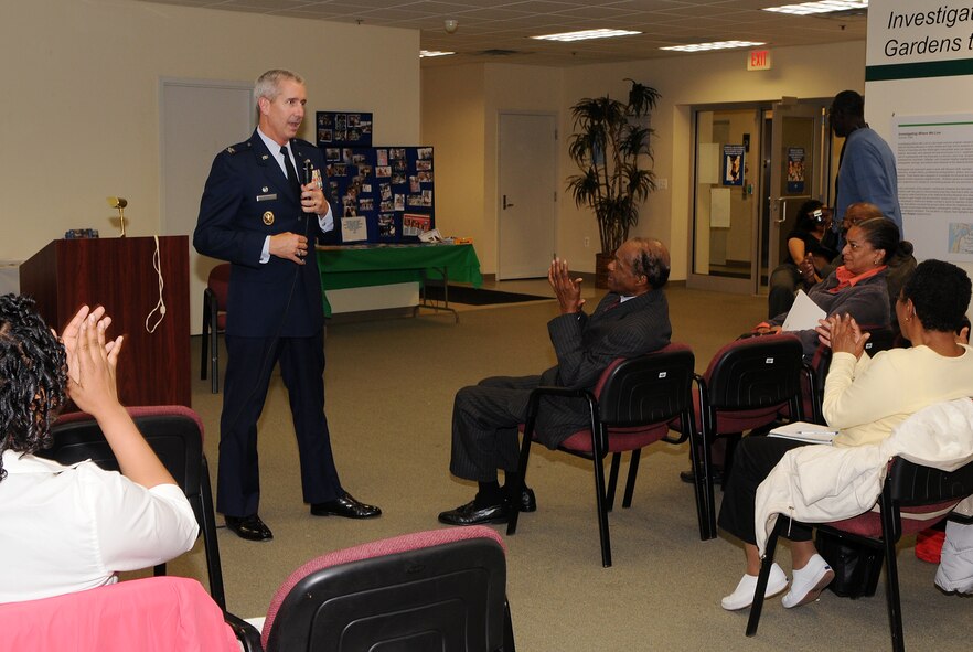 Col. Jon A. Roop, 11th Wing commander, speaks during a Congressional Heights Community Association meeting April 13 at the Petey Greene Community Service Center, Washington. Colonel Roop and Chief Master Sgt. Robin Johnson, 11th Wing command chief, attended the meeting. Colonel Roop spoke about several upcoming events at Bolling, to include the Fourth of July Jazz Fest, which will be open to the public. Both Colonel Roop and Chief Johnson talked with local residents about the Air Force and Bolling, after the official portion of the meeting. (U.S. Air Force photo by Senior Airman Marleah Miller)