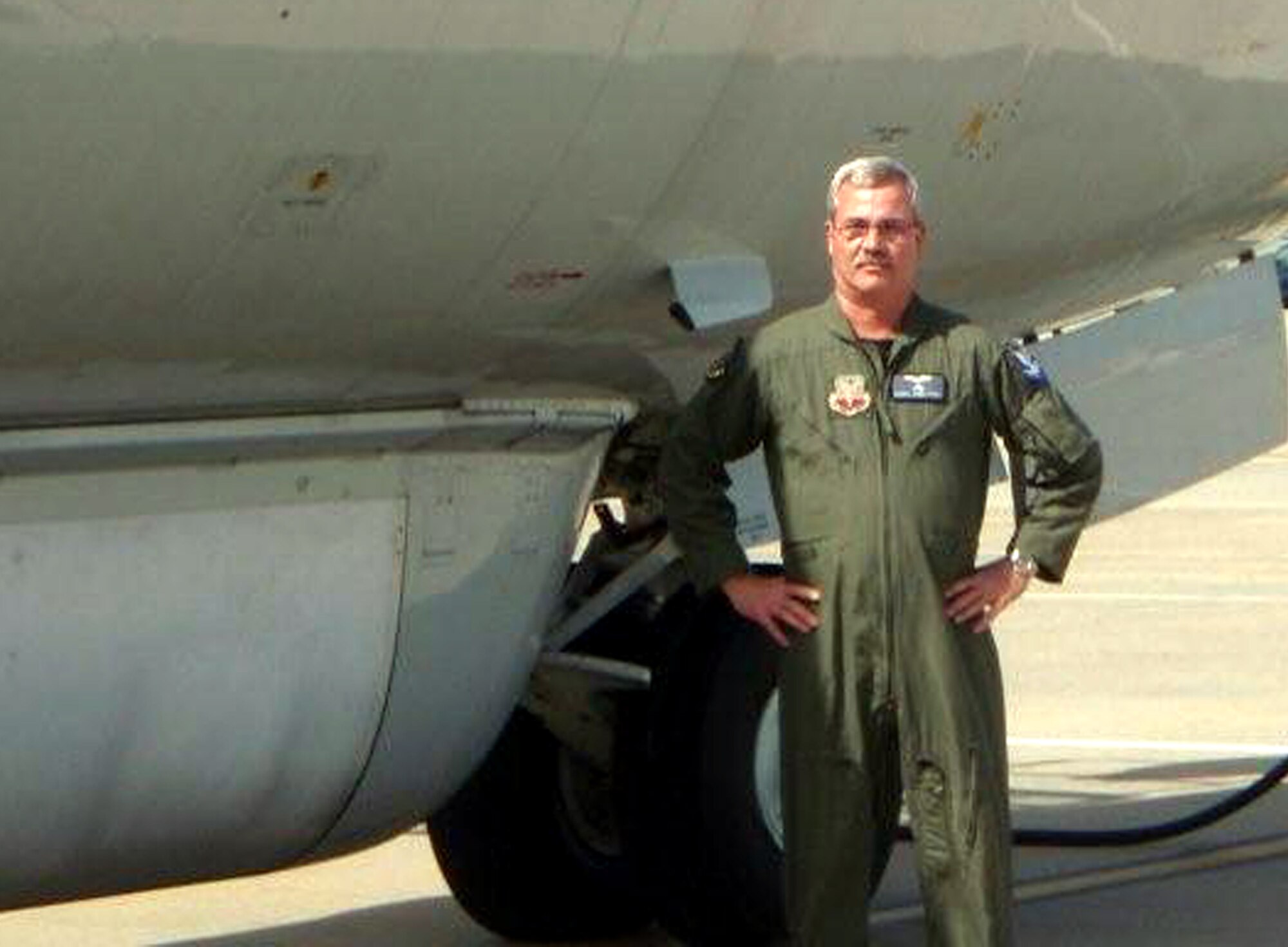 Chief Master Sgt. Randal Money, flight engineer for the E-8C Joint Surveillance Target Attack Radar System, or JSTARS, aircraft at the 128th Airborne Command and Control Squadron of the Georgia Air National Guard on Robins Air Force Base, Ga., stands next to his JSTARS plane prior to his final flight on April 9, 2009.  Chief Money's plane was refueled by his son, Staff Sgt. Kenneth Essick, a KC-10 boom operator from McGuire Air Force Base, N.J., during Chief Money's final flight.  (U.S. Air Force Photo)