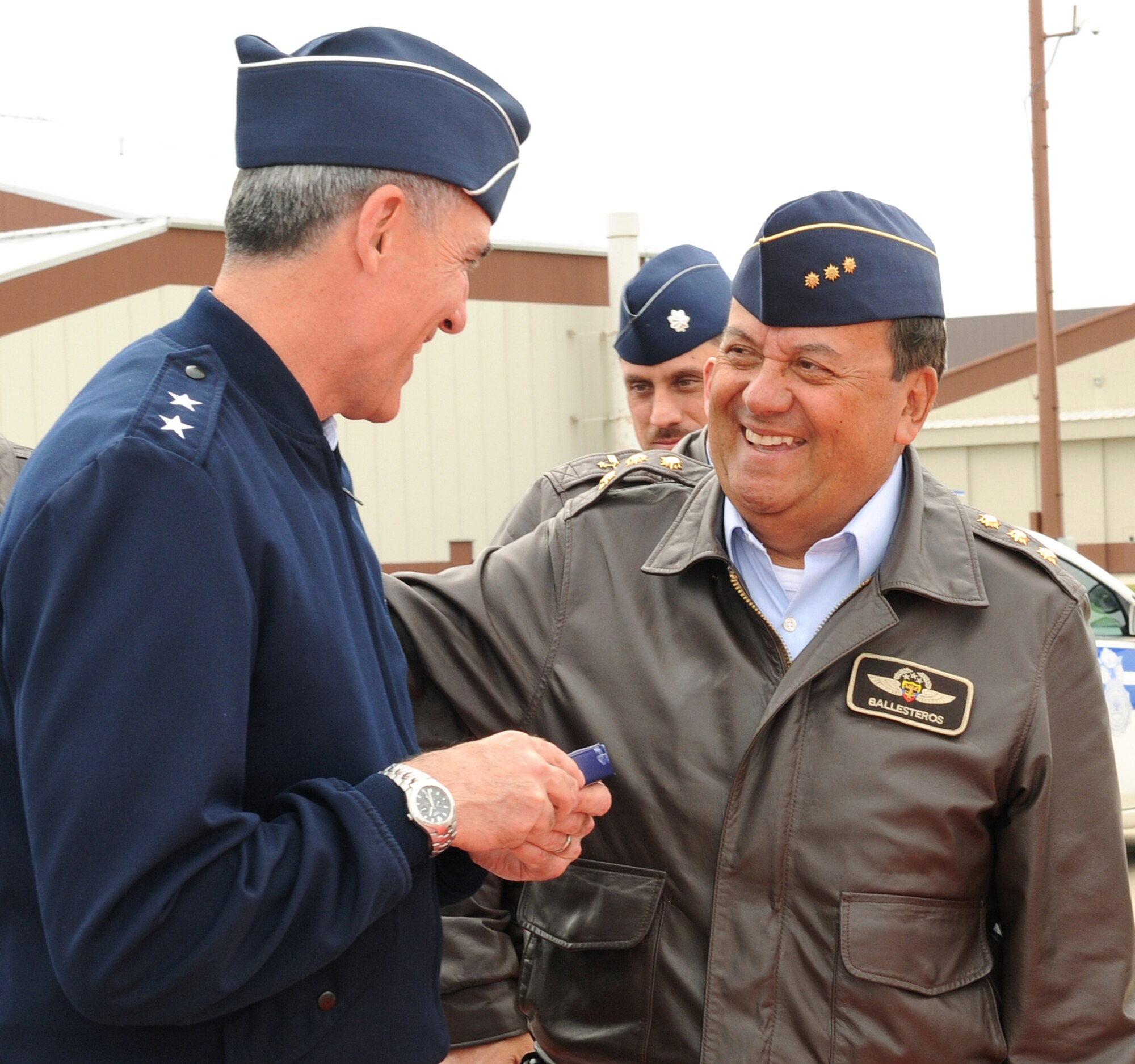 LANGLEY AIR FORCE BASE, Va.-- Maj. Gen. R. Mike Worden, Air Combat Command vice commander, receives a gift from Gen. Jorge Ballesteros Rodriguez, Colombian air force commander, here April 13. General Rodriguez received a base tour while being introduced to daily operations of the Air Force. (U.S. Air Force photo/Airman 1st Class Gul Crockett)