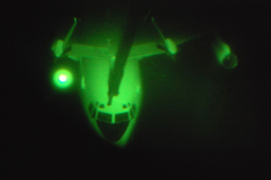 An E-8C Joint Surveillance Target Attack Radar System aircraft is refueled by a KC-10 Extender from McGuire Air Force Base, N.J., on April 9, 2009, somewhere over the southeastern United States.  The mission was special for Staff Sgt. Kenneth Essick, boom operator for the 2nd Air Refueling Squadron on McGuire, because he refueled his father's E-8C from the 116th Air Control Wing of Robins AFB, Ga.  His father, Chief Master Sgt. Randal Money, was on his final flight as a flight engineer for the E-8C.  (U.S. Air Force Photo/Tech. Sgt. Scott T. Sturkol)