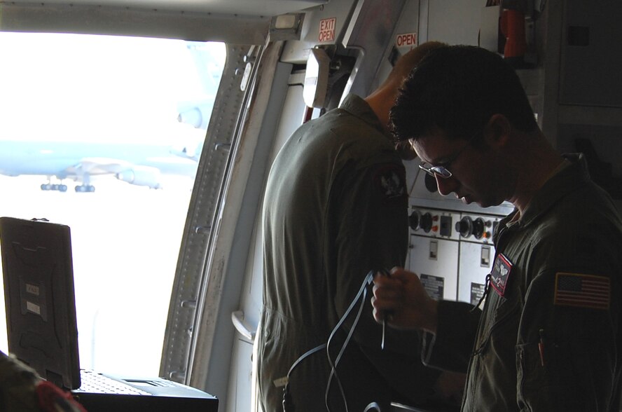 Capt. David Spellman, KC-10 pilot from the 2nd Air Refueling Squadron on McGuire Air Force Base, N.J., prepares for a local refueling mission April 9, 2009, inside a KC-10 on the McGuire flightline.  The 2nd ARS is one of McGuire's flying squadrons that uses the KC-10 Extenders for air refueling missions across the globe.  (U.S. Air Force Photo/Tech. Sgt. Scott T. Sturkol)