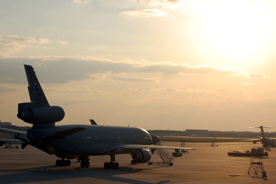 A KC-10 Extender is shadowed by the sun on the flightline at McGuire Air Force Base, N.J., on April 9, 2009.  The KC-10 Extender, an air refueling plane, is one of types of aircraft at McGuire that helps the Air Force and Air Mobility Command meet the service's global mission to "fly, fight and win...in air, space and cyberspace." (U.S. Air Force Photo/Tech. Sgt. Scott T. Sturkol)