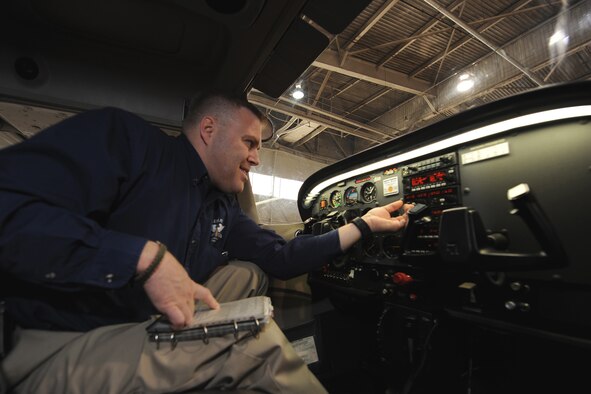 OFFUTT AIR FORCE BASE, Neb.- Scott Voichoskie, an instructor at the Lemay Aero Club, performs a preflight inspection on a Cessna 172 inside the Aero Club Hangar at Offutt April 9. Mr. Voichoskie said safety is critical in all elements of flying. Prior to leaving the hangar all aircraft undergo a thorough preflight inspection. Once the plane lands it will undergo a post flight inspection to ensure its still safe for flight.

U.S. Air Force Photo by Josh Plueger