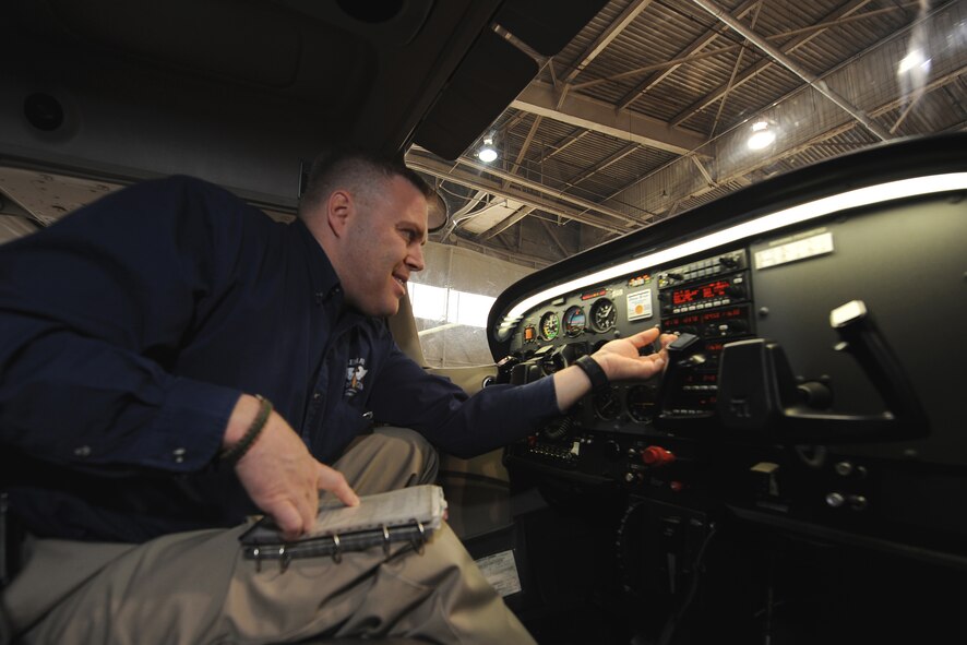 OFFUTT AIR FORCE BASE, Neb.- Scott Voichoskie, an instructor at the Lemay Aero Club, performs a preflight inspection on a Cessna 172 inside the Aero Club Hangar at Offutt April 9. Mr. Voichoskie said safety is critical in all elements of flying. Prior to leaving the hangar all aircraft undergo a thorough preflight inspection. Once the plane lands it will undergo a post flight inspection to ensure its still safe for flight.

U.S. Air Force Photo by Josh Plueger