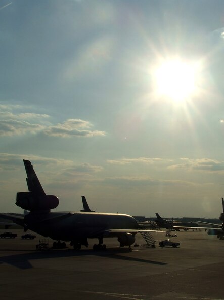 KC-10 Extenders are shadowed by the sun on the flightline at McGuire Air Force Base, N.J., on April 9, 2009.  The KC-10 Extender, an air refueling plane, is one of types of aircraft at McGuire that helps the Air Force and Air Mobility Command meet the service's global mission to "fly, fight and win...in air, space and cyberspace." (U.S. Air Force Photo/Tech. Sgt. Scott T. Sturkol)