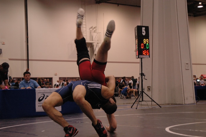 Airman 1st Class Nader Maghribe, 860 Air Maintenance Squadron, Travis Air Force Base throws his opponent during the 2009 Las Vegas/ASICS United States National Wrestling Championships April 8 through 11 at the Las Vegas Convention Center, 