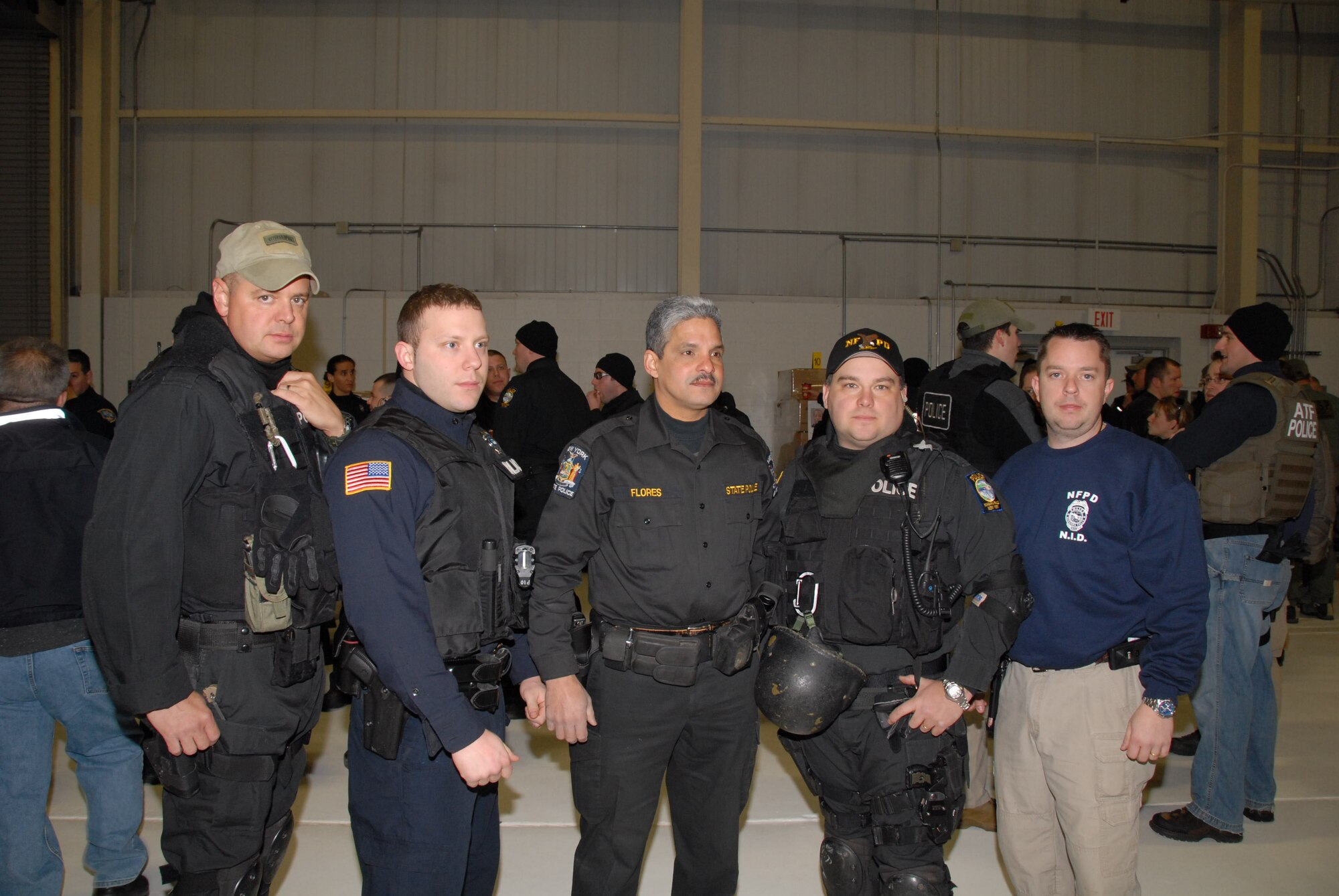 Members of the 107th Airlift Wing prepare to rid the streets of local gang thugs. From left: Command Chief Richard King, Staff Sgt. Tommy Rodgers, Master Sgt. Ricardo Flores, Capt. Bryan Dalporto and Master Sgt. Shawn Larrabee.