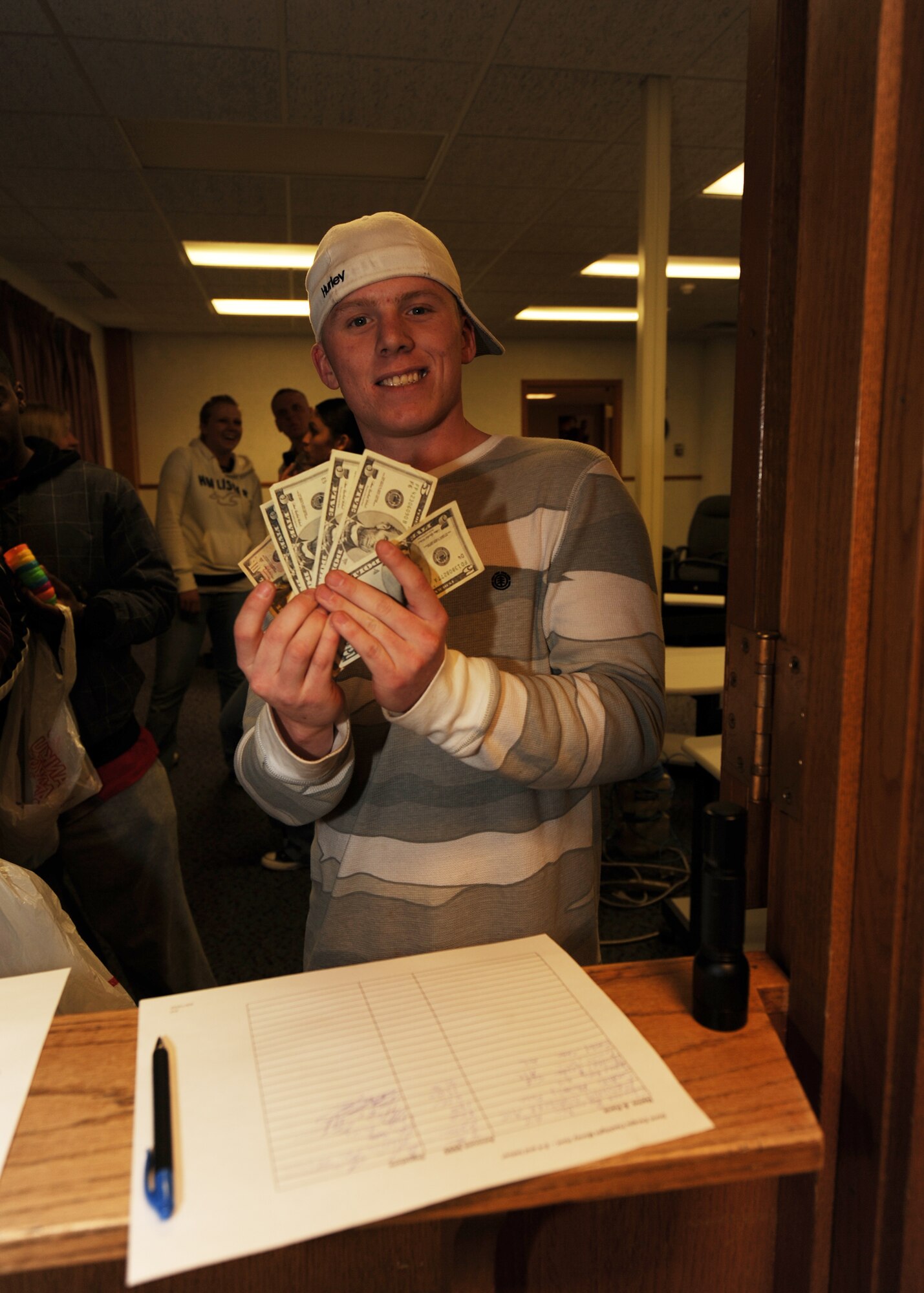 MINOT AIR FORCE BASE, N.D. - Airman 1st Class Sean Casey, 791st Missile Seurity Forces Squadron, displays the $35 he received participating in the Airmen's Flashlight Easter Egg Hunt at the Rough Riders Community Center here April 9. The egg hunt was open to Airmen who were E-4 and below, and featured cash awards totaling $500. (U.S. Air Force photo by Senior Airman Sharida Jackson)