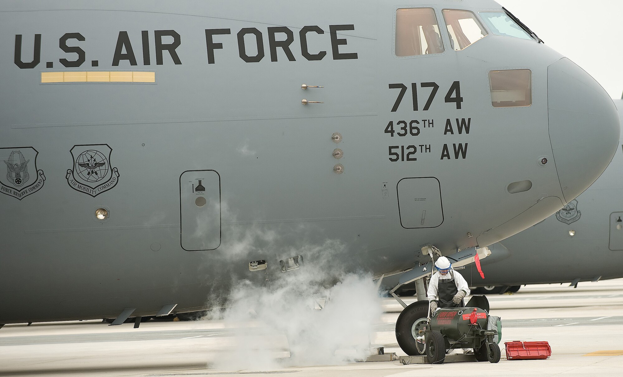 Airman 1st Class Jesse Garnett, 736th Aircraft Maintenance Squadron crewchief, services a C-17 Globemaster III liquid oxygen system as part of his daily duties. Aircrews use the oxygen system to breathe during high-altitude flying. Maintainers service liquid oxygen about four to five times a week. (U.S. Air Force photo/ Jason Minto)