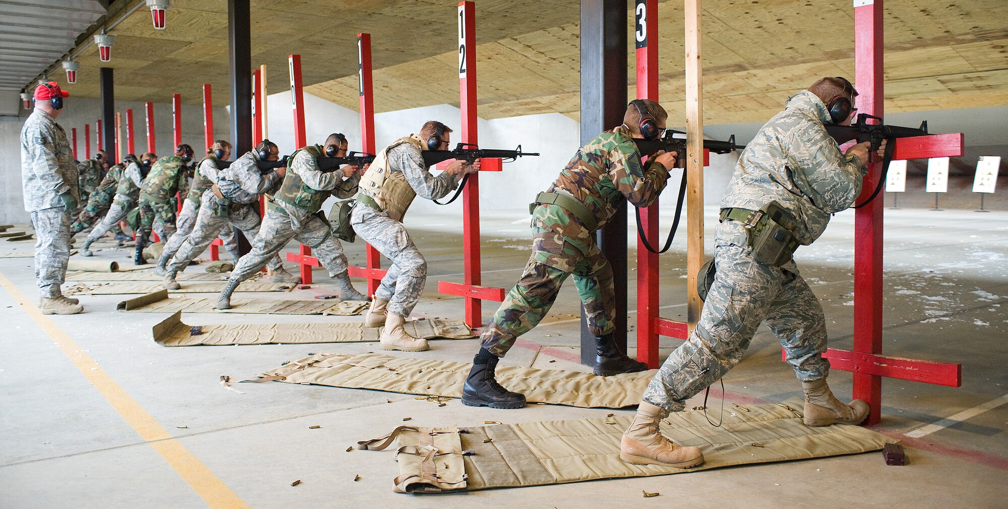 More than 25 Dover Airmen aim for their target during an M-16 Firing Class at the 436th Security Forces Squadron Combat Arms Training and Maintenance April 1. Airmen attended the weapons qualification course to maintain readiness standards. (U.S. Air Force photo/ Tom Randle)