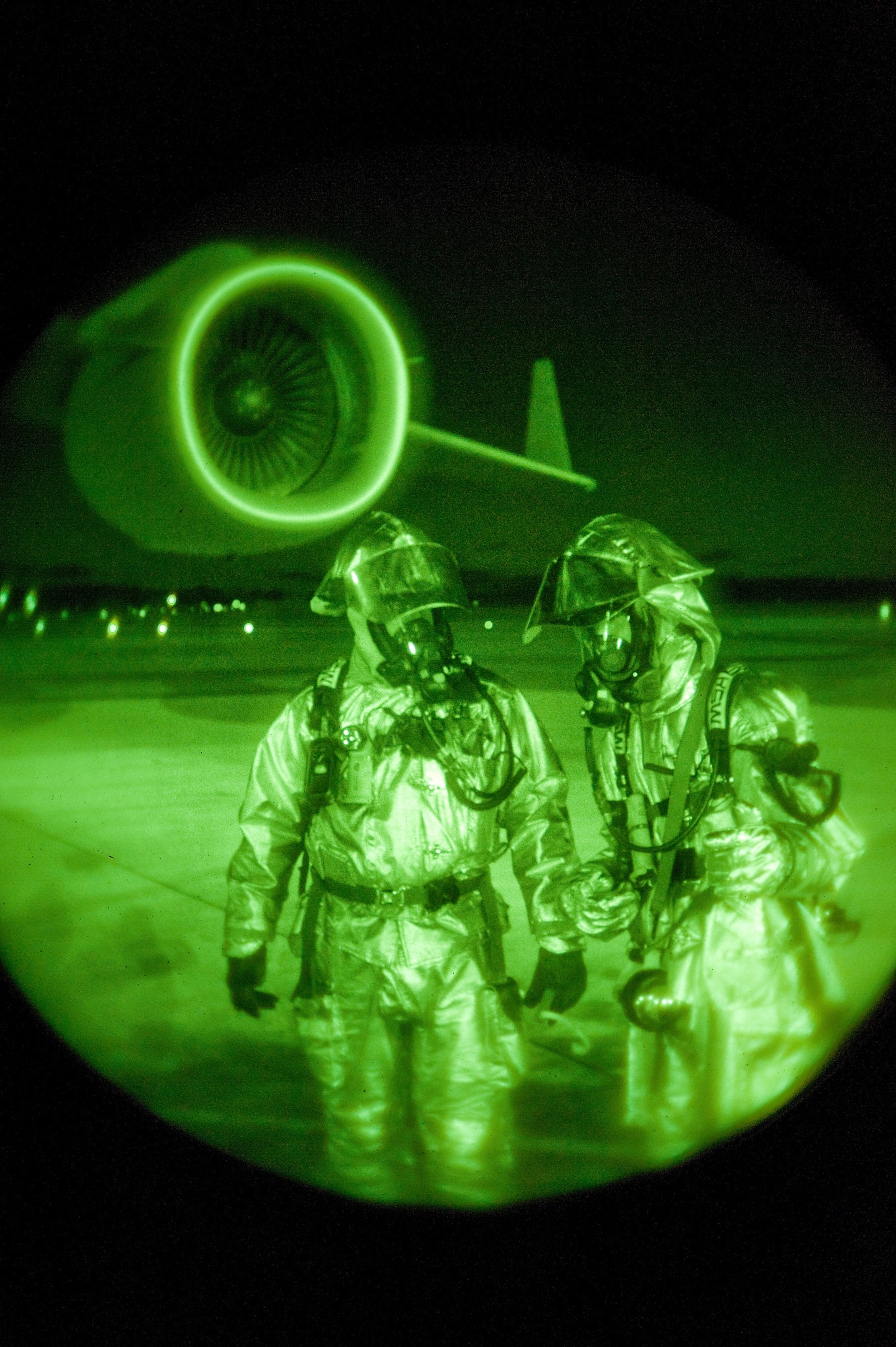 Two 436th Civil Engineer Squadron firefighters respond to a simulated accident at Dover Air Force Base during a Major Accident Response Exercise April 9. In daylight or darkness, Dover’s emergency responders test their skills during MAREs. (U.S. Air Force photo/Tom Randle)