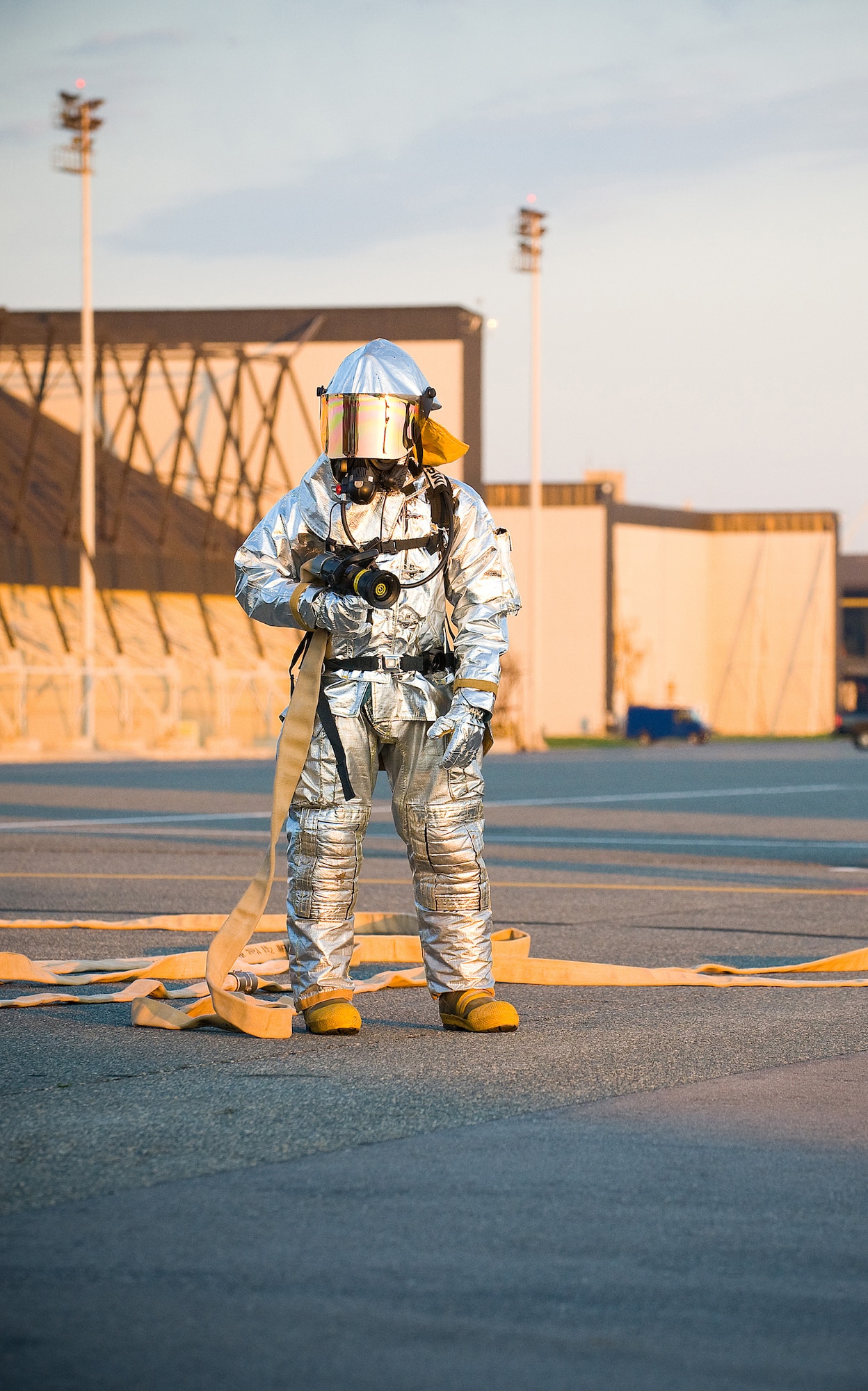 A 436th Civil Engineer Squadron firefighter awaits orders from the fire chief and other emergency responders while participating in a Major Accident Response Exercise at Dover Air Force Base April 9. Air Force bases routinely hold MAREs to train and test the responses of base personnel in emergency situations. (U.S. Air Force photo/Tom Randle)