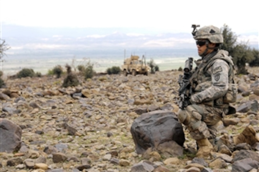 A U.S. Army soldier provides security while other soldiers from Delaware Company, 1st Battalion, 501st Parachute Infantry Regiment, Task Force Steel conduct a key leader engagement at Shabow-Kheyl, Afghanistan, on April 8, 2009.  