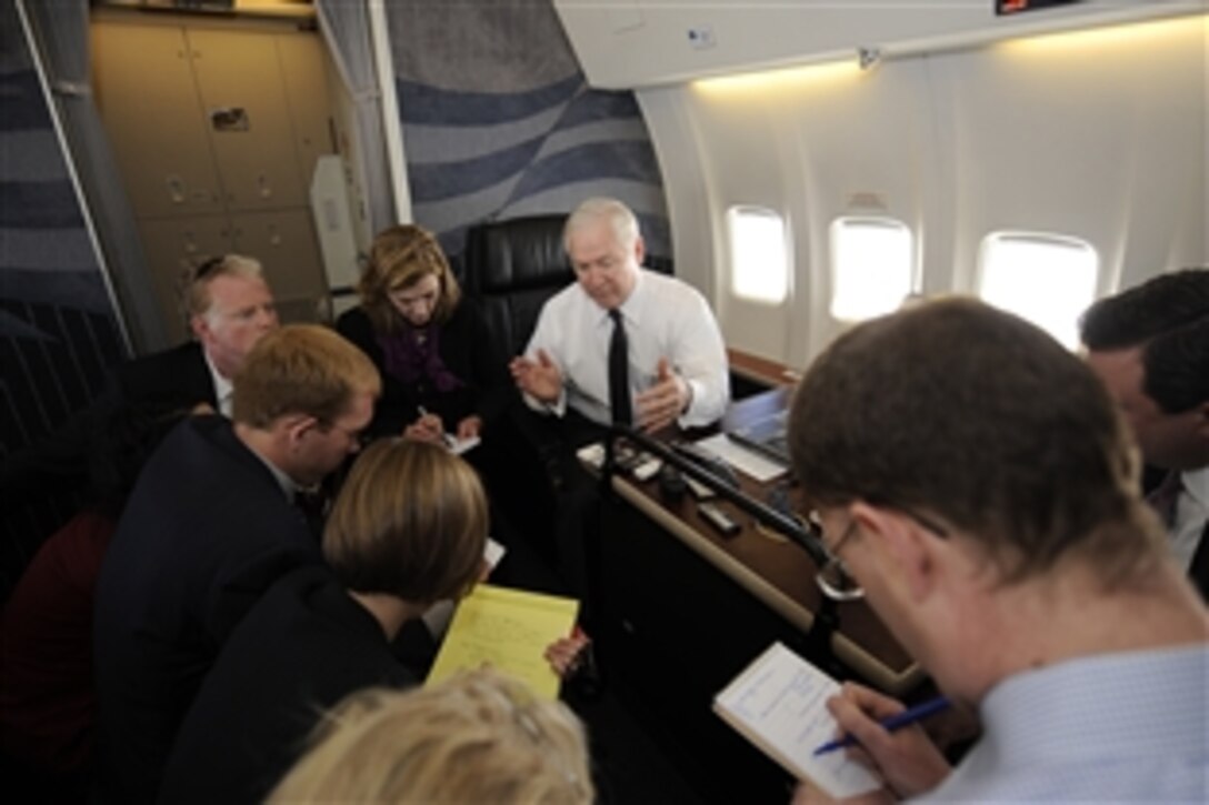 Defense Secretary Robert M. Gates talks with members of the press on board a C-40 aircraft enroute to Dothan, Ala., April 14, 2009, during a two-day trip to Alabama. 