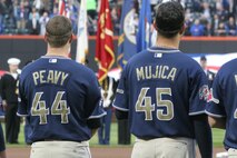 San Deigo Padres pitchers Jake Peavy and Edward Mujica watch a joint-service color guard march on the new home for the New York Mets, Citi Field, April 13. (Official U.S. Marine Corps Photo by Sgt. Randall A. Clinton)
