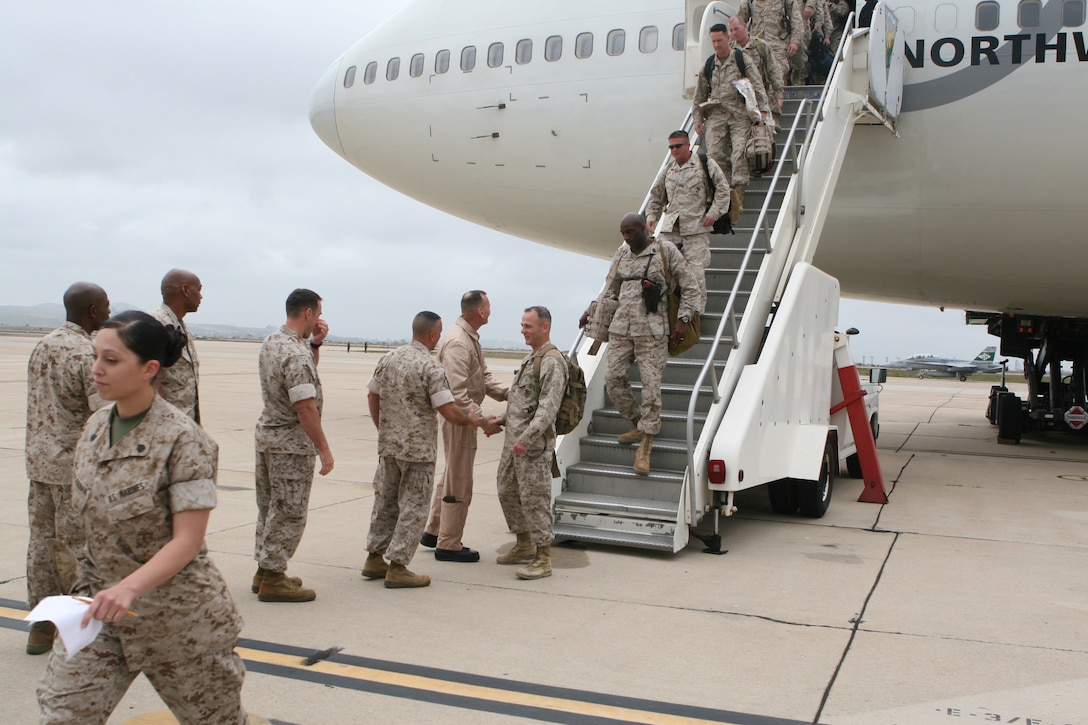 MARINE CORPS AIR STATION MIRAMAR- Marines from Marine Medium Helicopter Squadron 161 and Marine Aviation Logistics Squadron 16 debark a Northwest Airlines plane during a homecoming event at the Visiting Aircraft Line here Apr. 14.  The squadrons, both 3rd Marine Aircraft Wing units, returned from their deployment in support of Operation Iraqi Freedom. (U.S. Marine Corps photo by Cpl. Fredrick J. Coleman)