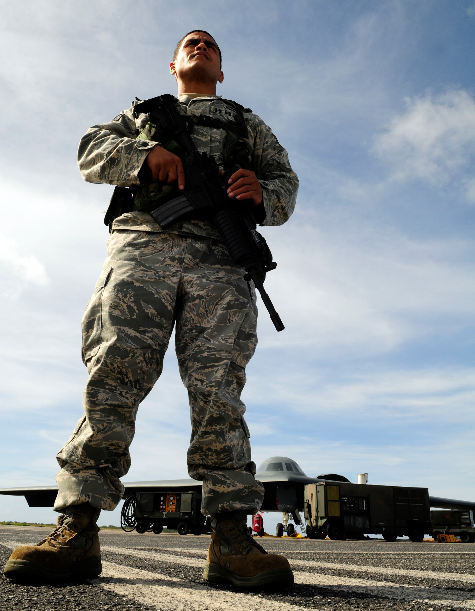 ANDERSEN AIR FORCE BASE, Guam - Staff Sgt. Shaun Morrison, 254th Security Forces Active Guardsman, posts in front of a B-2 Spirit here April 15. Sgt. Morrison was recently named Pacific Forces Airman of the Year for Air National Guard. (U.S. Air Force photo by Airman 1st Class Courtney Witt)