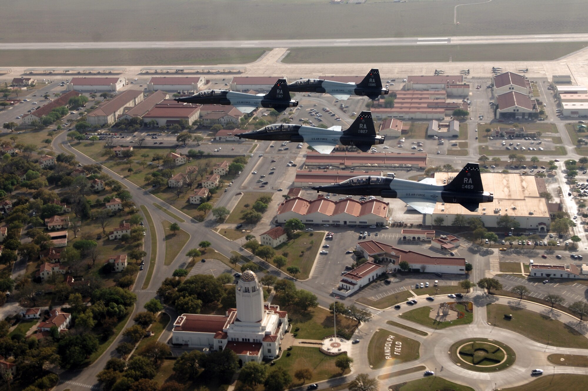 Four T-38 Talons fly over Randolph Air Force Base, Texas.  The T-38 completed its first flight 50 years ago on April 10, 1959.  In five decades of service, more than 75,000 pilots have flown in a T-38 while earning their wings.  (U.S. Air Force photo/Master Sgt. Scott Reed)