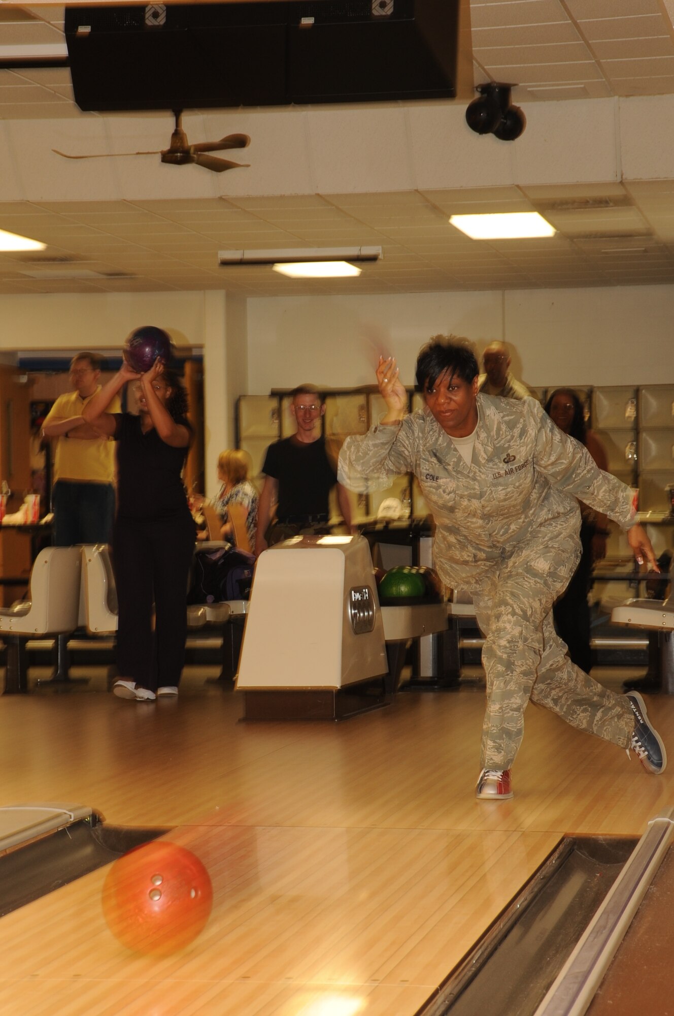 Senior Master Sgt. Stacey Cole, Air Force Financial Services Center temporary duty branch chief and a victim advocate, tosses her ball scoring eight pins at the Bandit Lanes bowling alley here April 14.  Ellsworth's Sexual Assault Prevention and Response office hosted this bowling event to bring awareness to the Child Abuse Prevention and Sexual Assault Awareness Month campaigns to Ellsworth personnel. (U.S. Air Force photo/Senior Airman Anthony Sanchelli)

