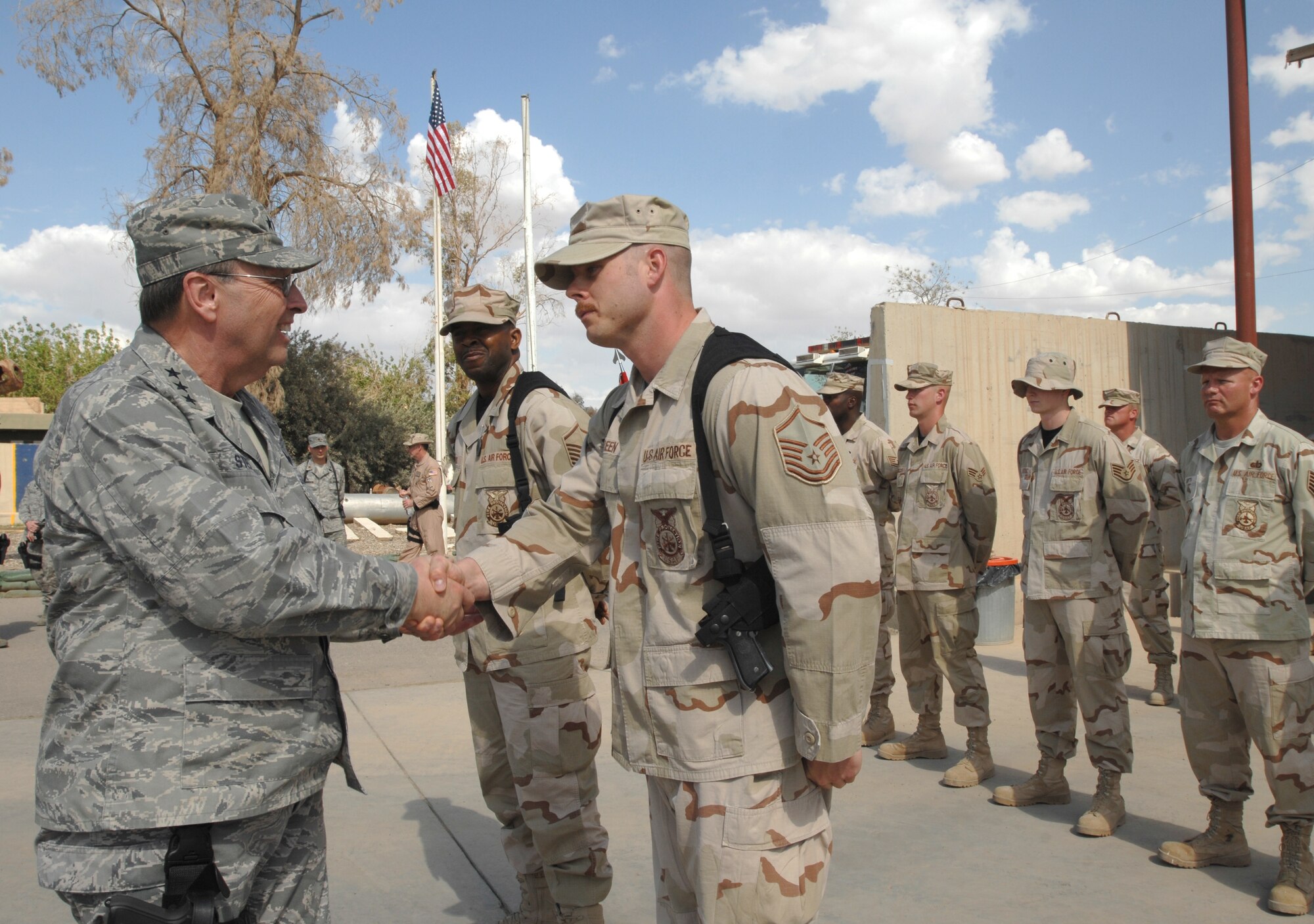 Master Sgt. Jacob Green, a deployed Reservist from the 446th Civil Engineer Squadron, McChord Air Force Base, Wash., greets Lt. Gen. Charles Stenner, Air Force Reserve Command commander, during the general's visit to Kirkuk Regional Air Base, Iraq.  Sergeant Green is serving as the assistant chief of operations for the 506th Expeditionary Civil Engineer Squadron's Fire and Emergency Services.  (U.S. Air Force photo/Staff Sgt. Eunique P. Stevens)