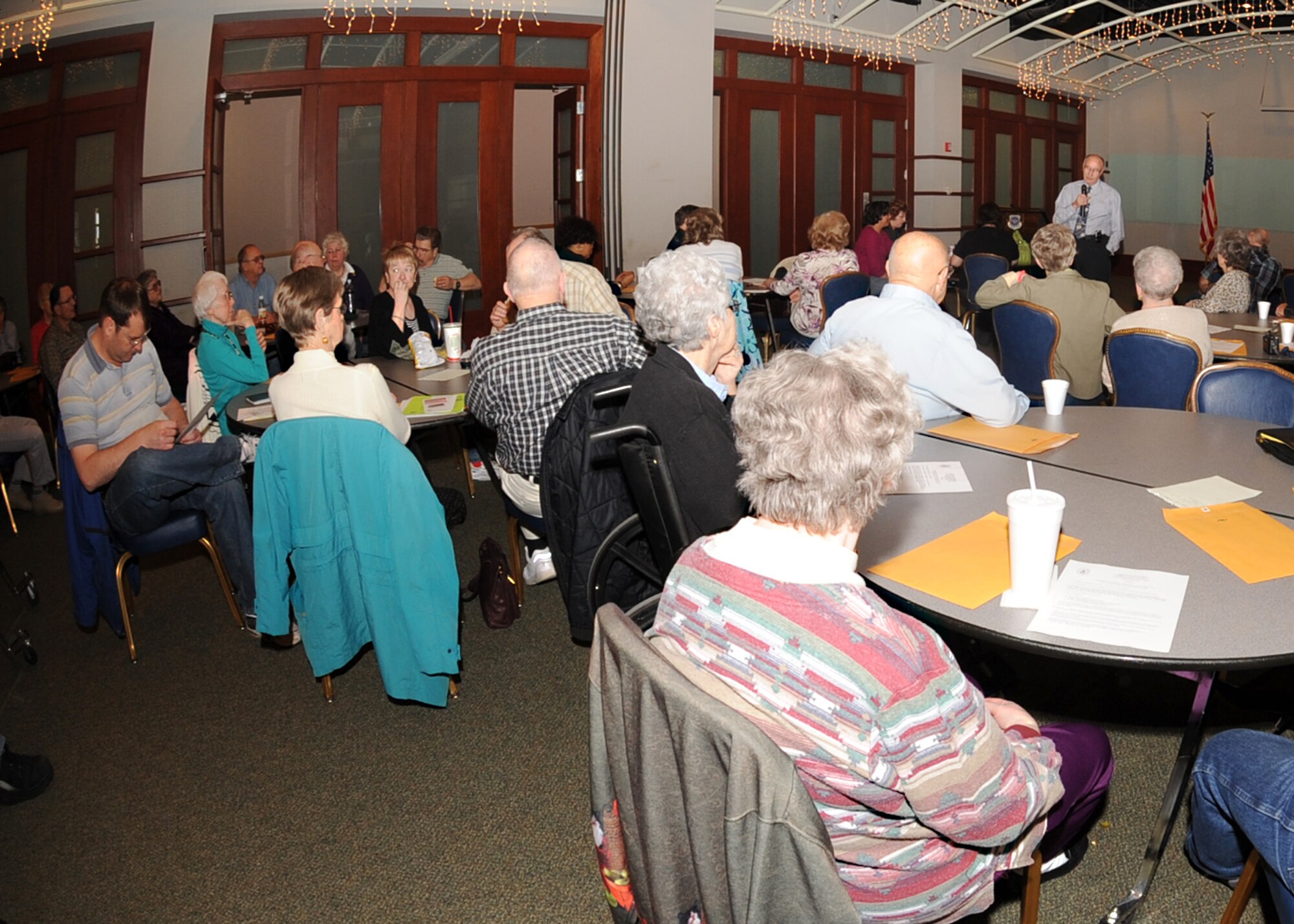 Guest speaker, retired Lt. Col. Robert Lamkey, Director of Public Safety of Sedgwick County, talks to retirees and their families at the Retiree Luncheon at Signatures Lounge on April 14. The Retiree Luncheon held every second Tuesday of the month is open to retirees and their families from all military branches. (Photo by Airman 1st Class Ruiz)