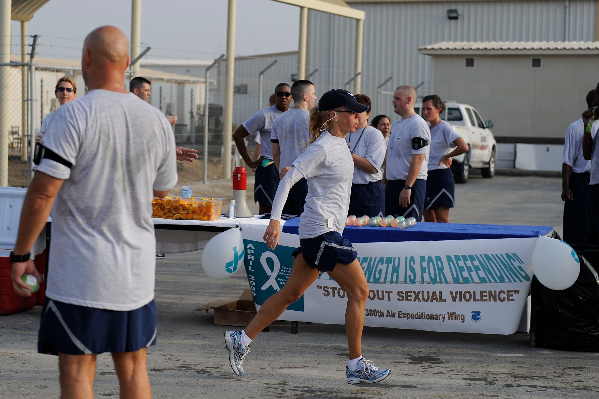 Master Sgt. Lisa Arnold finishes a 10k run April 8 at an air base in Southwest Asia. The run was one of several events held to recognize Sexual Assault Awareness Month. Sergeant Arnold was the fastest female in the 10k run with a time of 48:45. She is assigned to the 380th Expeditionary Communications Squadron and is deployed from Andrews Air Force Base, Md.  (U.S. Air Force photo/Senior Airman Brian J. Ellis)