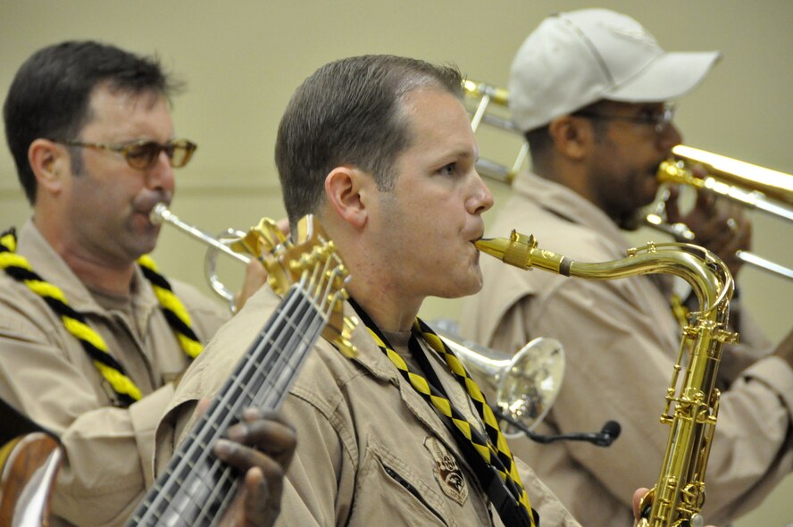 KONA, Hawaii -  U.S. Air Force Band of the Pacific - Hawaii members Master Sgt. Davie Jenkins, a native of Norfolk, Neb; Staff Sgt. Joshua Fedele, a saxophonist and Tech Sgt. Mike Hornbuckle, a native of Huntingdon, West Virginia perform at Kohala High School on April 9, as part of a community outreach program. (U.S.  Air Force photo/Tech Sgt. Cohen A. Young)