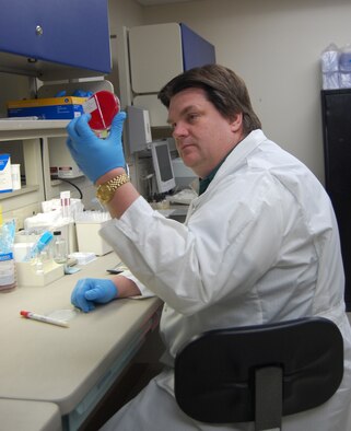 Geoff Fallon, floor supervisor at the Malmstrom clinic lab, checks the growth of a microbiology specimen. Mr. Fallon has been working at the lab for 16 years. (U.S. Air Force photo/Valerie Mullett)