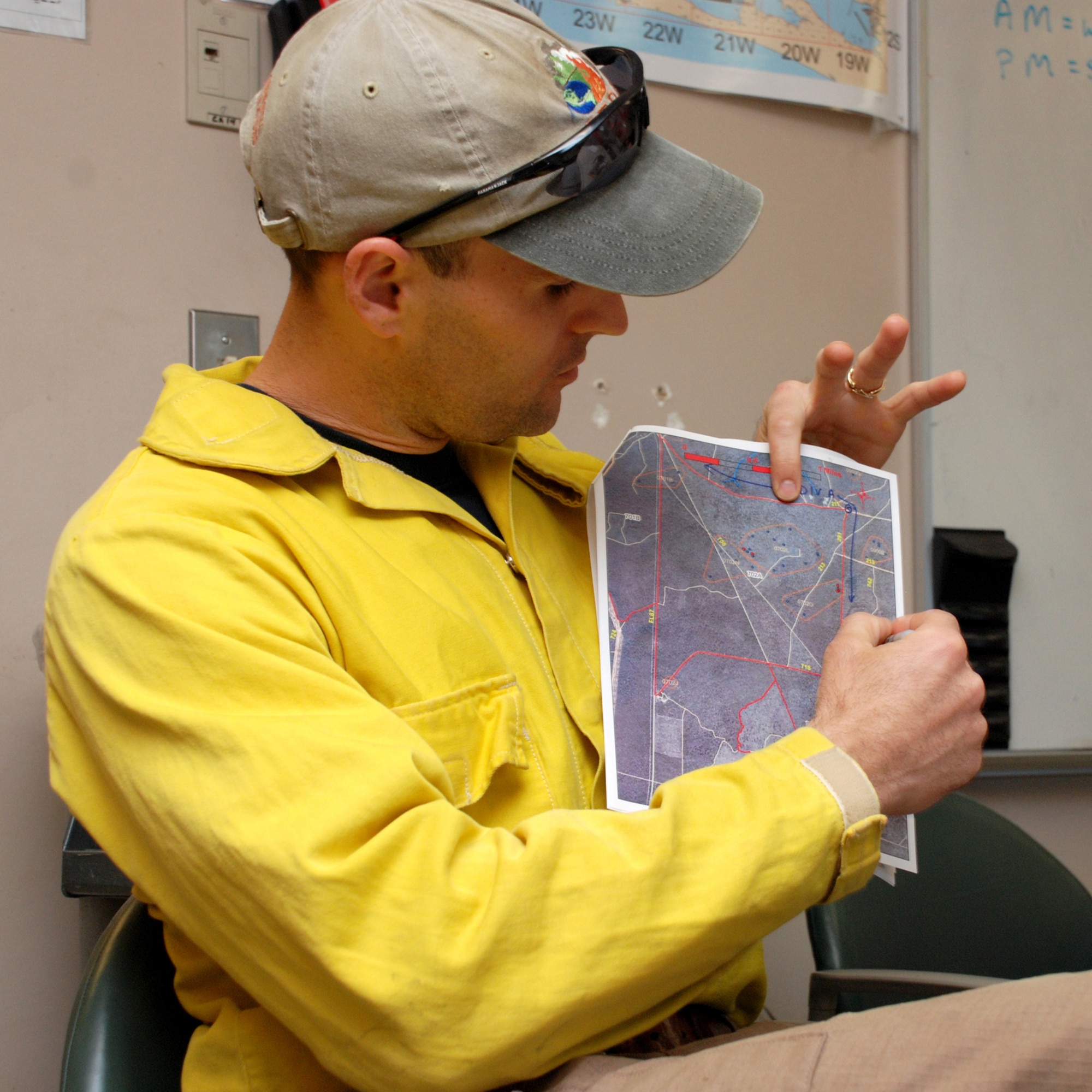 EGLIN AIR FORCE BASE, Fla. -- Kevin Heirs, Eglin Natural Resources prescribed fire program manager, goes over the area they have chosen to do a prescribed burn with crewmembers April 8. The fire management technicians at Jackson Guard's Natural Resources branch uses prescribed fire techniques to keep a delicate longleaf pine ecosystem thriving while keeping the military mission a priority year round. Eglin is the largest Air Force base in the U.S. with more than 464,000 acres of land, and is home to more than 77 state and federally listed rare species. With more than 100,000 acres burned last season, the goal is to burn a five-year average of 70,000 acres per year. So far this season, the fire management program has burned more than 76,000 acres. (U.S. Air Force photo/Mike Meares)
