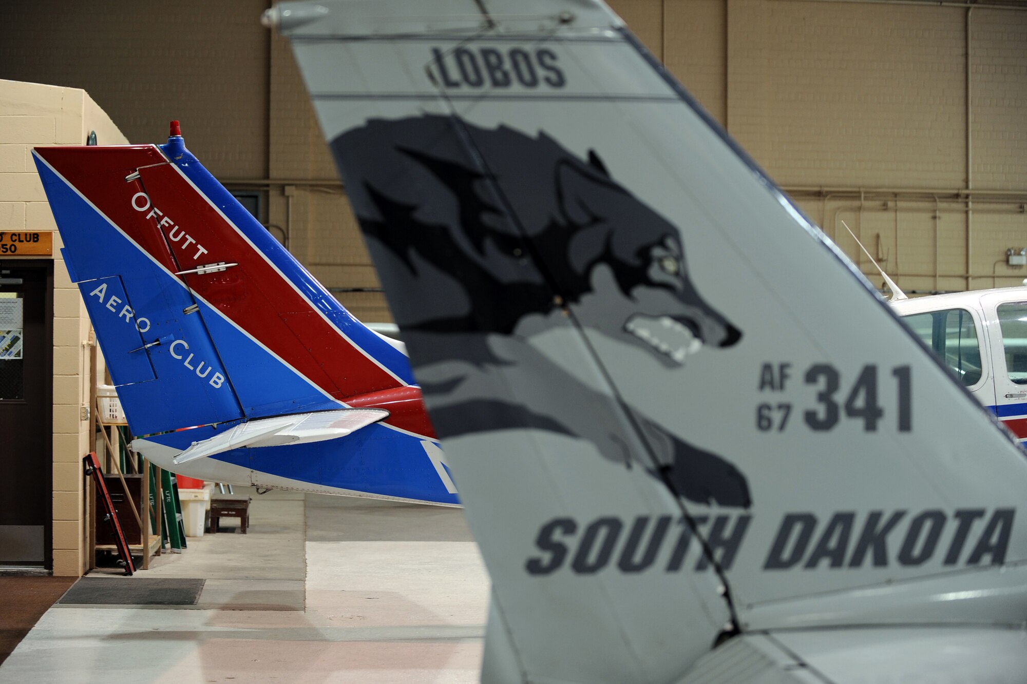 OFFUTT AIR FORCE BASE, Neb. - A Cessna-C172H (foreground) and a BE-55 Baron (background), sit in the LeMay Aero Club hangar. The Cessna-C172H is a single engine airplane that can climb 720 feet per second and can fly at altitudes exceeding 13,000 feet. The BE-55 Baron is a twin engine airplane, which can fly at higher altitudes and greater speeds than the Cessna. Both aircraft can be flown by aspiring pilots at the aero club.  U.S. Air Force Photo by Josh Plueger