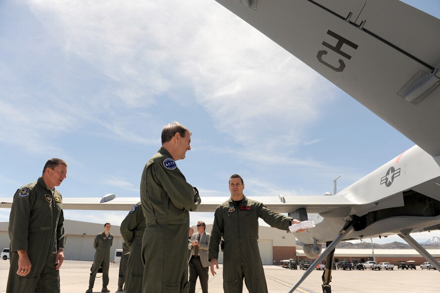 CREECH AFB, Nev. -- Colonel John Montgomery (right), 432nd Wing and 432nd Air Expeditionary Wing vice commander, briefs Gen. Stephen Lorenz, Commander, Air Education Training Command, on the capabilities of the MQ-9 Reaper at Creech, April 9. (U.S. Air Force Photo/Senior Airman Larry E. Reid Jr.)