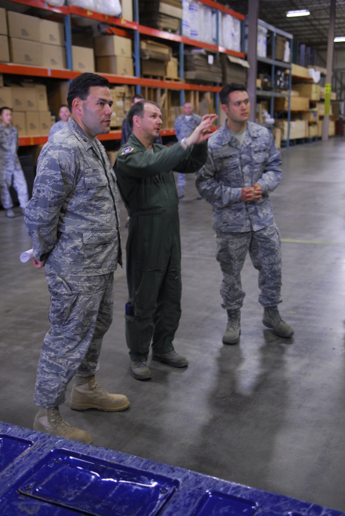 Col. Steven Winters (center), the 30th Space Wing vice commander at Vandenberg Air Force Base, Calif., along with Maj. Manuel Perez (left), the 30th Logistics Readiness Squadron commander, and Tech. Sgt. Forrest Chambers, the 30th LRS surface cargo noncommissioned officer in charge, discuss the changes April 9 to be made to the cargo area of Building 5500. With the help of the Vandenberg's Air Force Smart Operations for the 21st Century team of experts, the 30th LRS will receive a month-long makeover to increase the overall efficiency of the cargo area. (U.S. Air Force photo/Airman 1st Class Steve Bauer)