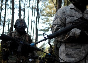 Charleston Airmen patrol the perimeter of the Expeditionary Combat Skills Training area on Charleston AFB April 8. ECST is required for Airmen who are deploying to hostile areas where combat knowledge and skills are required. This training occurs biweekly. (U.S. Air Force photo/Senior Airman Katie Gieratz)
