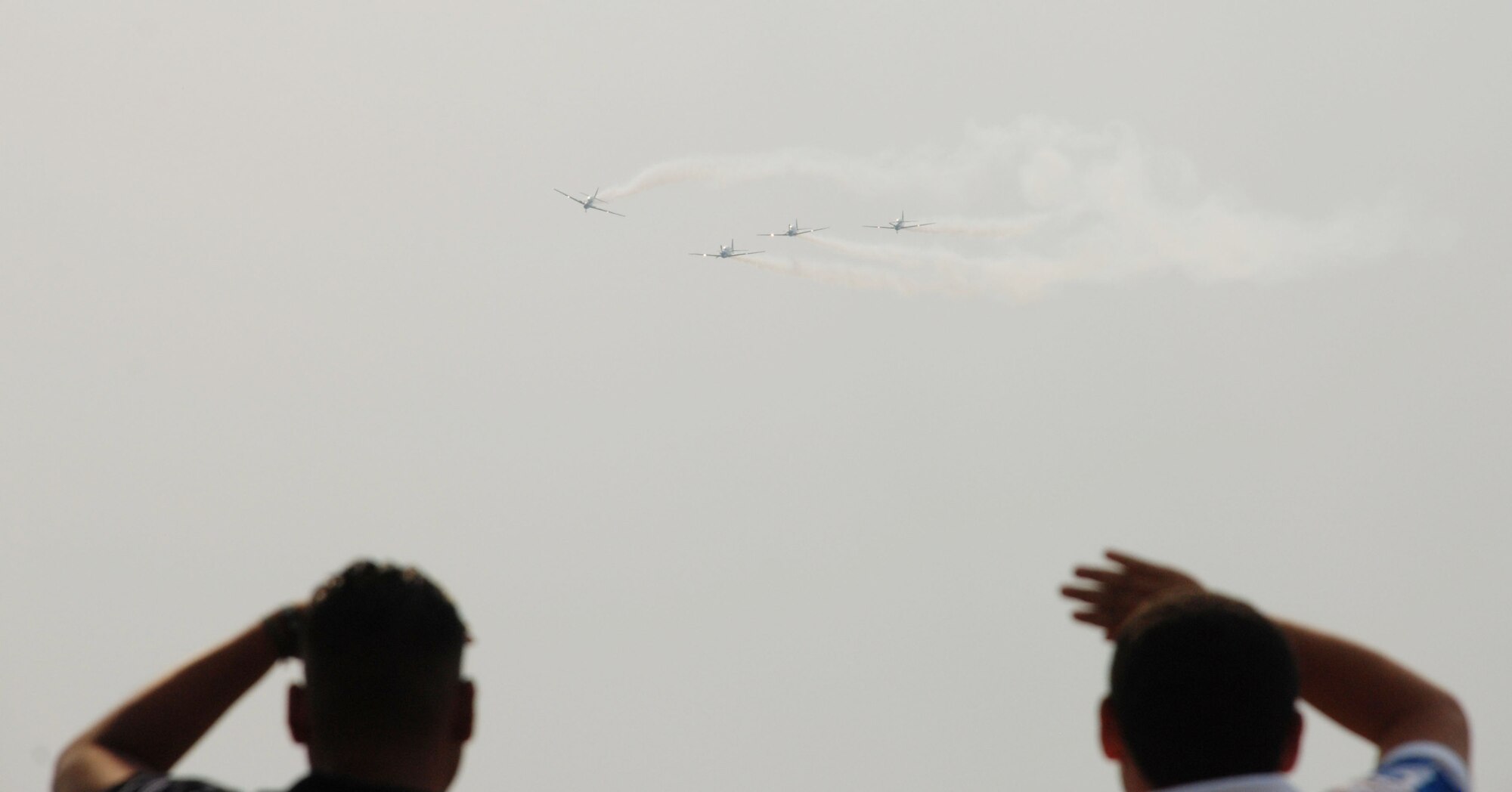 SOTO CANO AIR BASE, Honduras - A team from the Brazilian Air Force Air Demonstration Squadron performs a nearly one-hour demonstration at Tegucigalpa Airport April 14.  Also known as Smoke Squadron, the Brazilian team flies the Embraer EMB 312 Tucano and has been on display since May 1952.  Airmen and Soldiers from Joint Task Force-Bravo here were on hand to support the show.  (U.S.. Air Force photo/Tech. Sgt. Rebecca Danét)