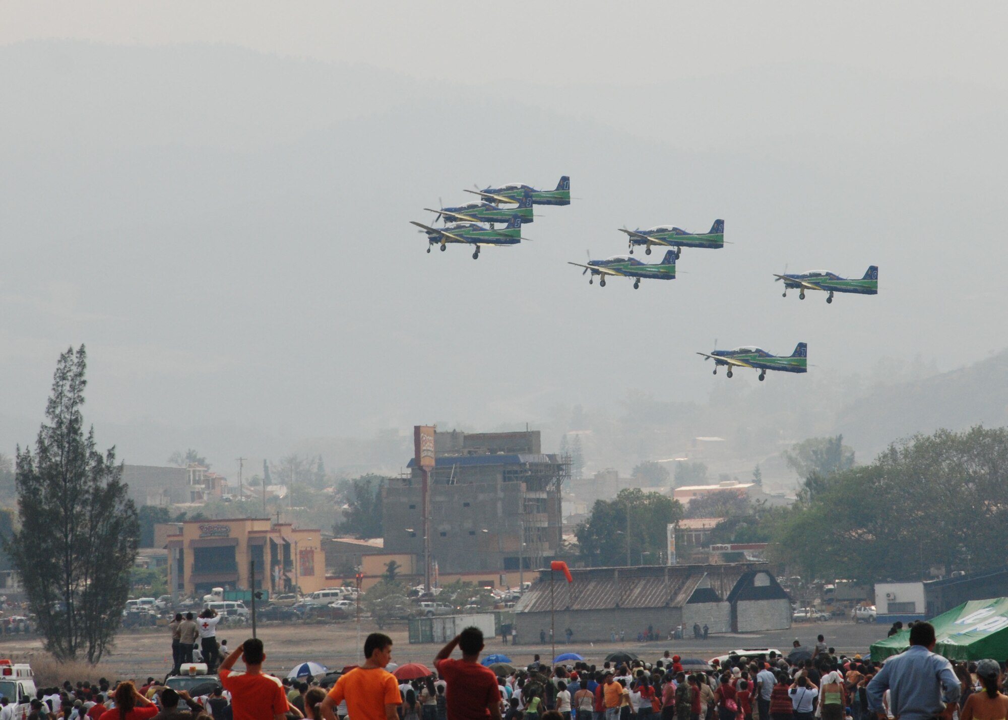 SOTO CANO AIR BASE, Honduras - Aircraft from the Brazilian Air Force Air Demonstration Squadron take off from Tegucigalpa Airport to perform an air show for thousands of on-lookers April 14.  Also known as Smoke Squadron, the Brazilian team flies the Embraer EMB 312 Tucano and has been on display since May 1952.  Airmen and Soldiers from Joint Task Force-Bravo here were on hand to support the show.  (U.S.. Air Force photo/Tech. Sgt. Rebecca Danét)