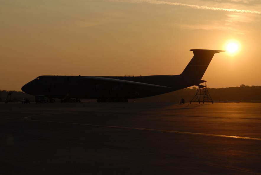 WRIGHT-PATTERSON AFB, Ohio - The sun rising in the background illuminates a C-5A Galaxy sitting on the flight line early one morning.  (Air Force photo/ Staff Sgt. Ken LaRock) 