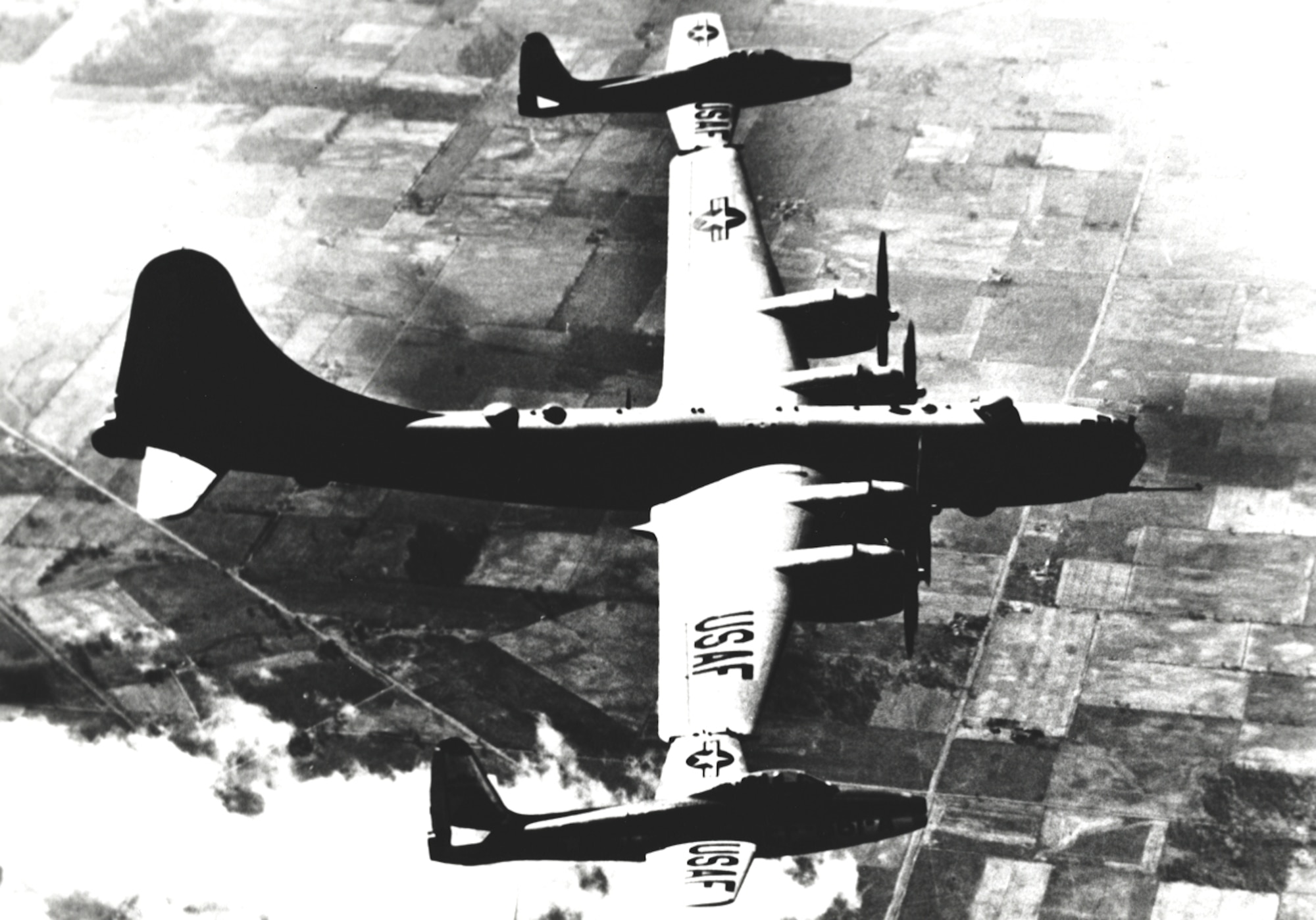 Prior to developing inflight refueling for fighter aircraft, the U.S. Air Force experimented with projects such as ?Tip-Tow,? which investigated the towing of aircraft like these two F-84s by bombers such as the B-29. (U.S. Air Force historical photo)