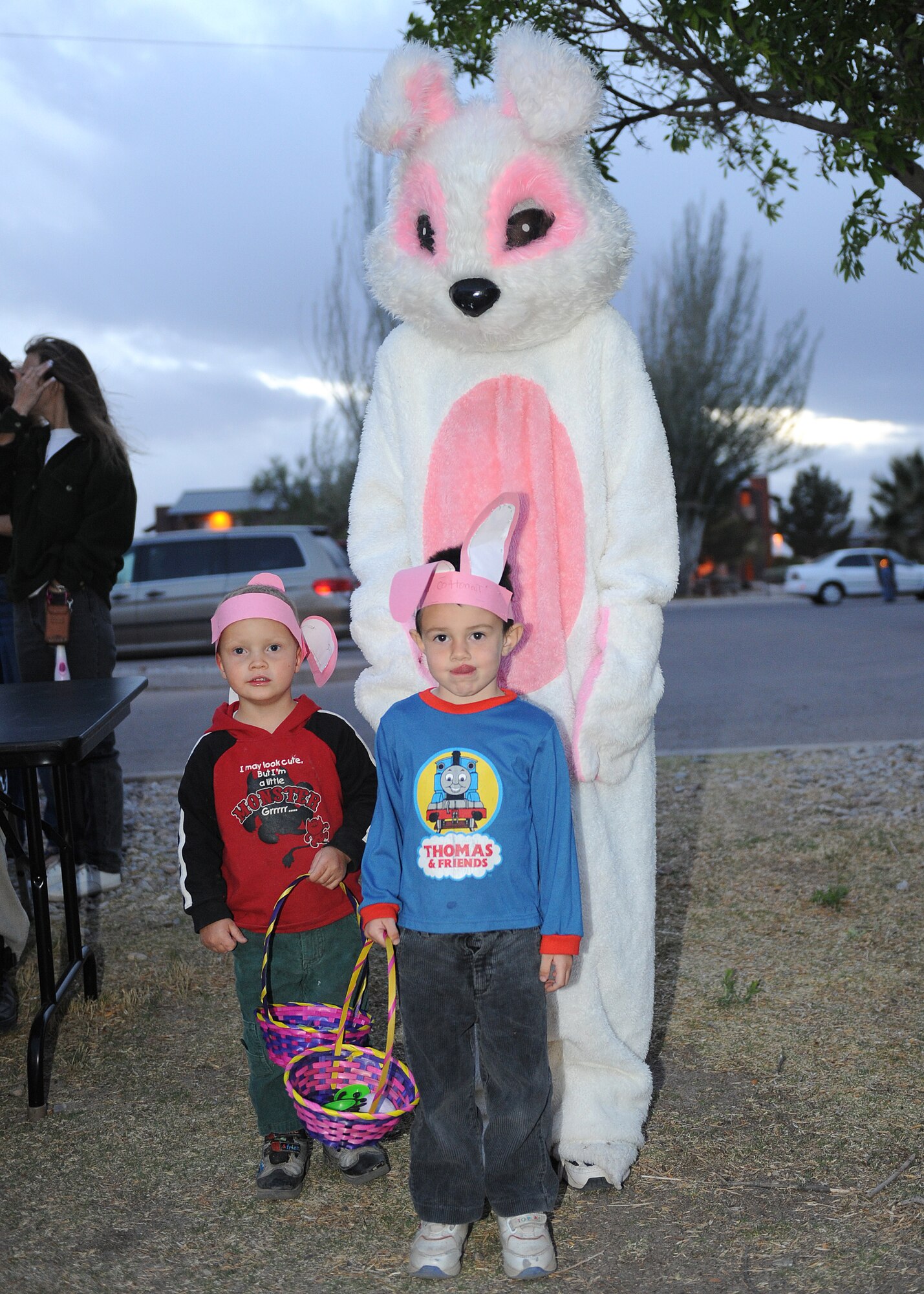 David and Alex Westfall, sons of Chap. (Capt.) Olga Westfall, 49th Fighter Wing, stand by the Easter bunny at Steinhoff Park after the Easter Egg Hunt on Holloman AFB, N.M., April 10. Over 1500 easter eggs were hidden throughout Steinhoff park for the hunt. (U.S. Air Force photo/Senior Airman Michael Means)