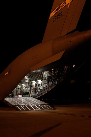 A Charleston C-17 sits on the tarmac at Dover AFB Del., April 7 where the remains of Army Spc. Israel Candelaria Mejias wait for transport to the Air Force Mortuary Affairs Operations Center where his body was prepared for the final trip back to San Lorenzo, Puerto Rico. The 14th Airlift Squadron was tasked with the mission of bringing the remains of Specialist Mejias back to the U.S. (Photos by Leo Shane III. Used with permission from the Stars and Stripes. © 2009 Stars and Stripes)