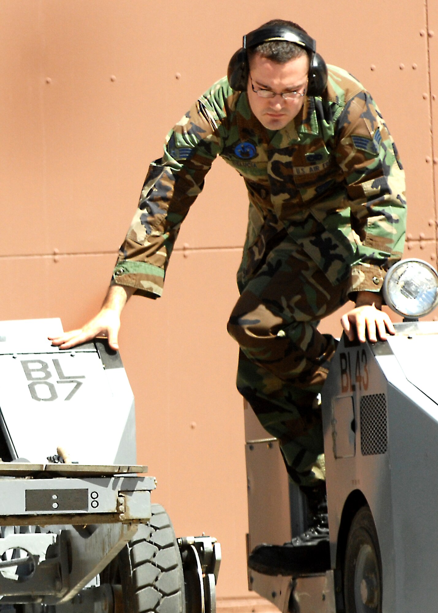 Senior Airman Patrick Delucia exits out of a MJ-1 Jammer during the 49th Maintenance Group, Load Crew of the Quarter competition April 10, 2009, Holloman Air Force Base, N.M. 



 (U.S. Air Force photo/SSgt Anthony Nelson Jr)
