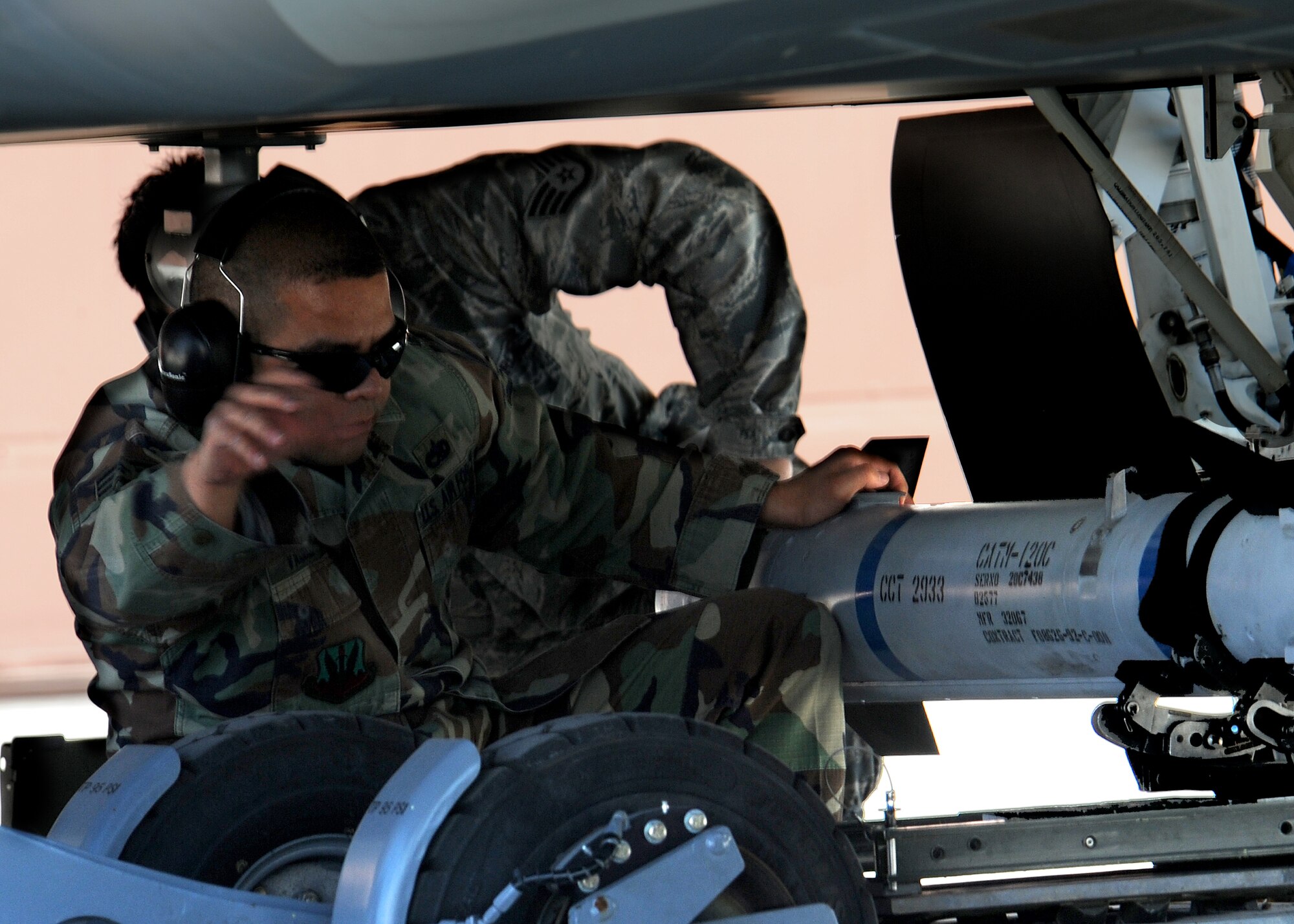 Staff Sgt. Alberto Vazquez, 49th Aircraft Maintenance Squadron, loads a bomb onto an F-22A Raptor while competing in the Quarterly Load Crew  competition, April 10, at Holloman Air Force Base, N.M.  (U.S. Air Force photo/Senior Airman Michael Means)